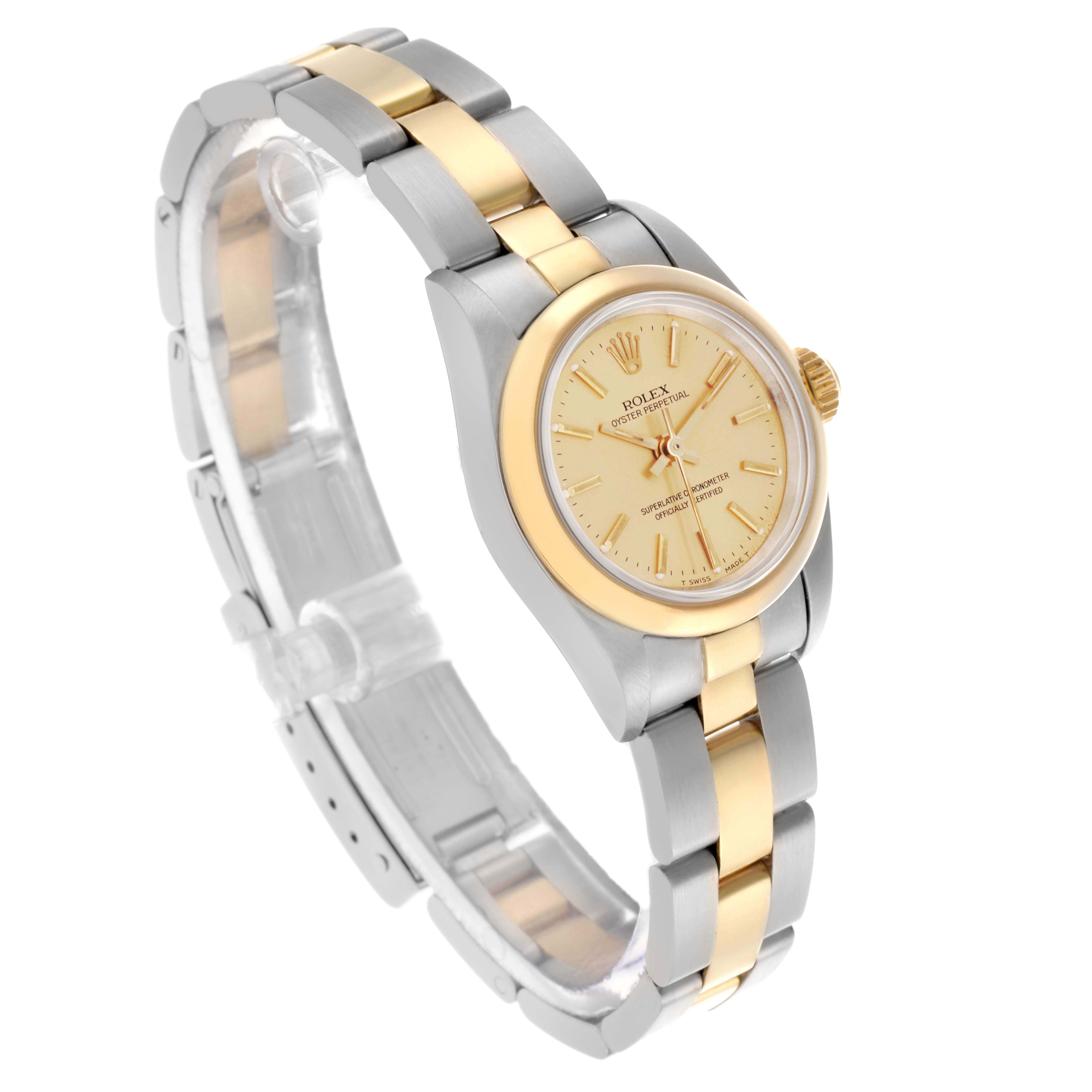 The Rolex Oyster Perpetual 67183 Women's Steel and Gold (two tone) Champagne Dial 67183 Women's Steel and Gold (two tone) Champagne Dial watch is shown at a slight angle, displaying the face, bezel, and full bracelet.