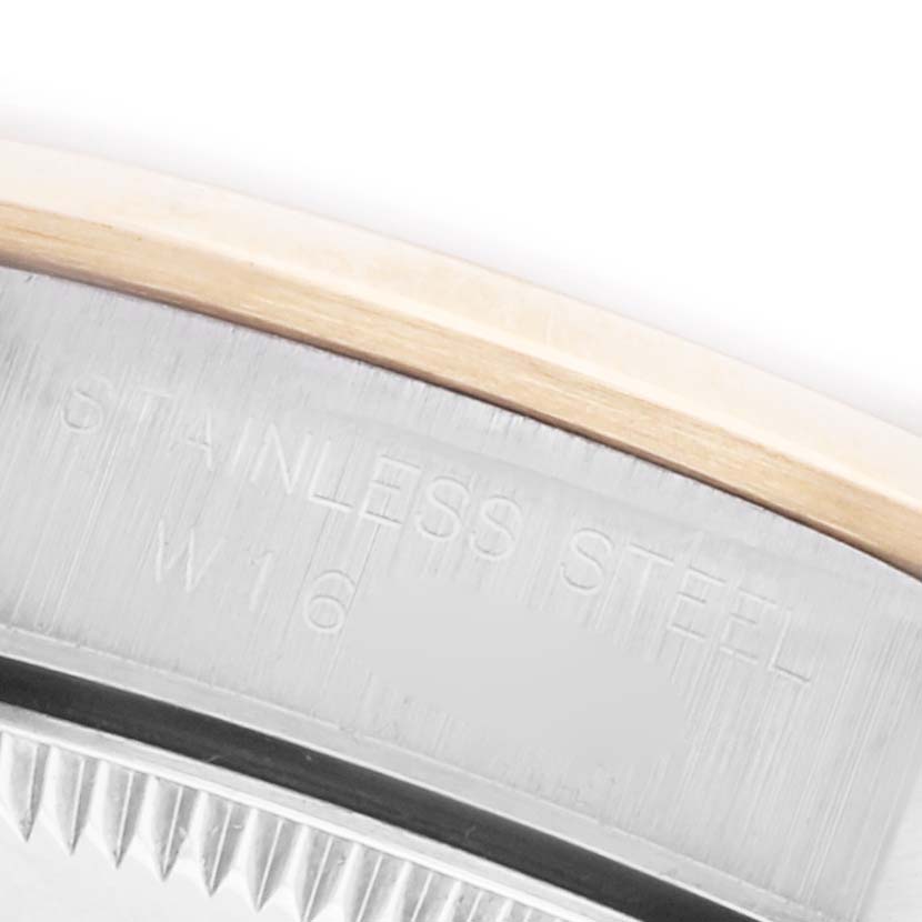 The image shows a close-up of the stainless steel case back of a Rolex Oyster Perpetual 67183 Women's Steel and Gold (two tone) Champagne Dial 67183 Women's Steel and Gold (two tone) Champagne Dial watch, highlighting the engraved text.