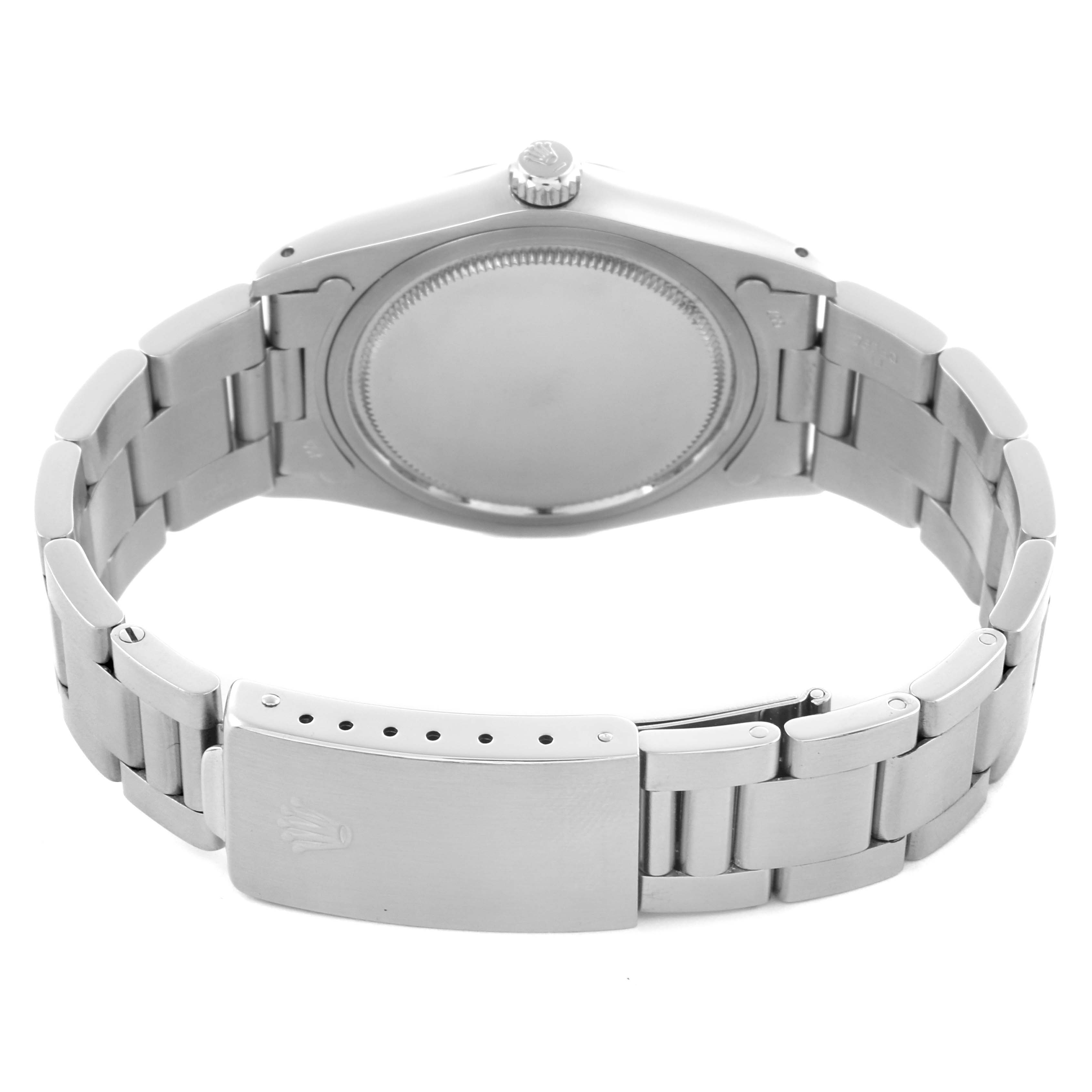 The image shows the back of a Rolex Date 6694 Men's Stainless Steel Silver Dial 6694 Men's Stainless Steel Silver Dial model watch, highlighting the case back, bracelet, and clasp.