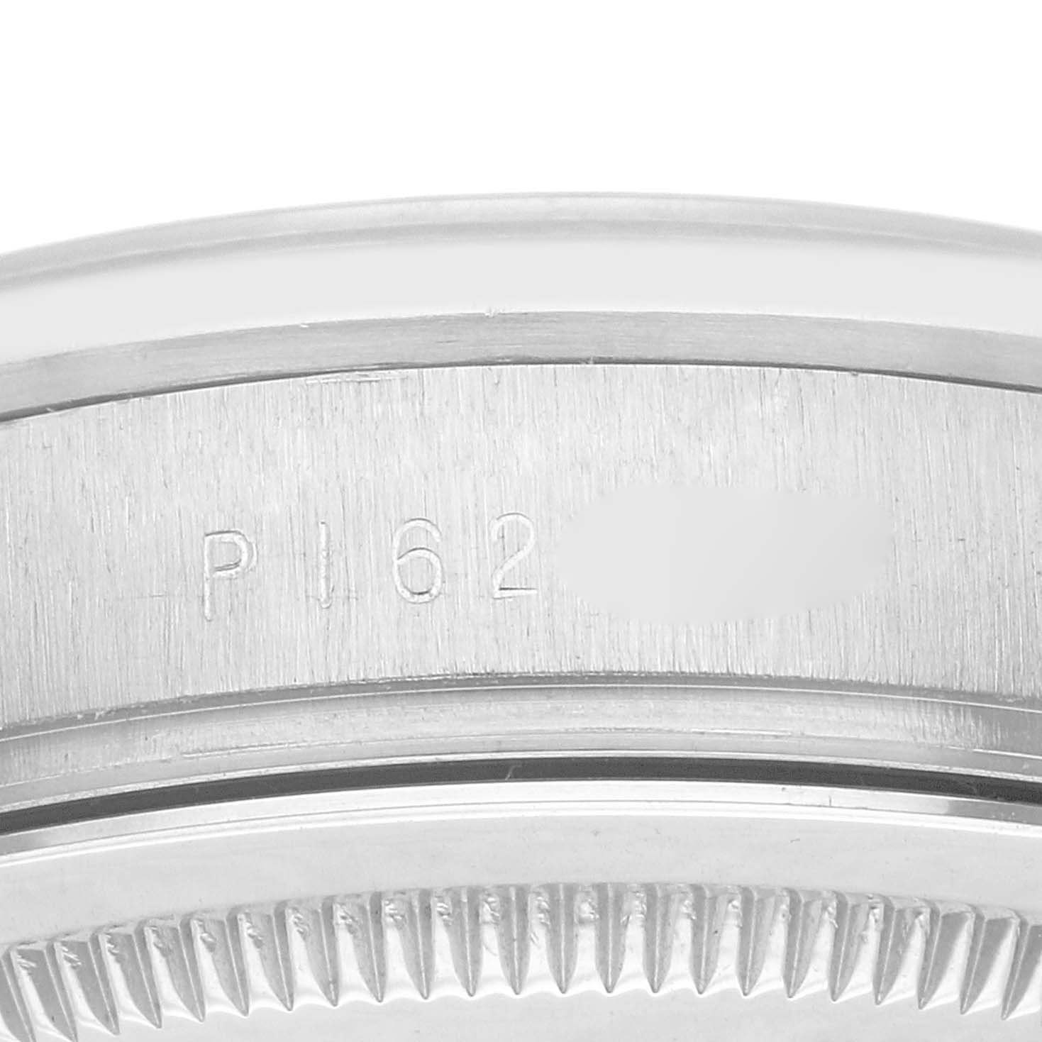 This close-up image shows the side case and bezel of a Rolex President 118209 Men's White Gold Silver Dial 118209 Men's White Gold Silver Dial model, focusing on engraved serial numbers.