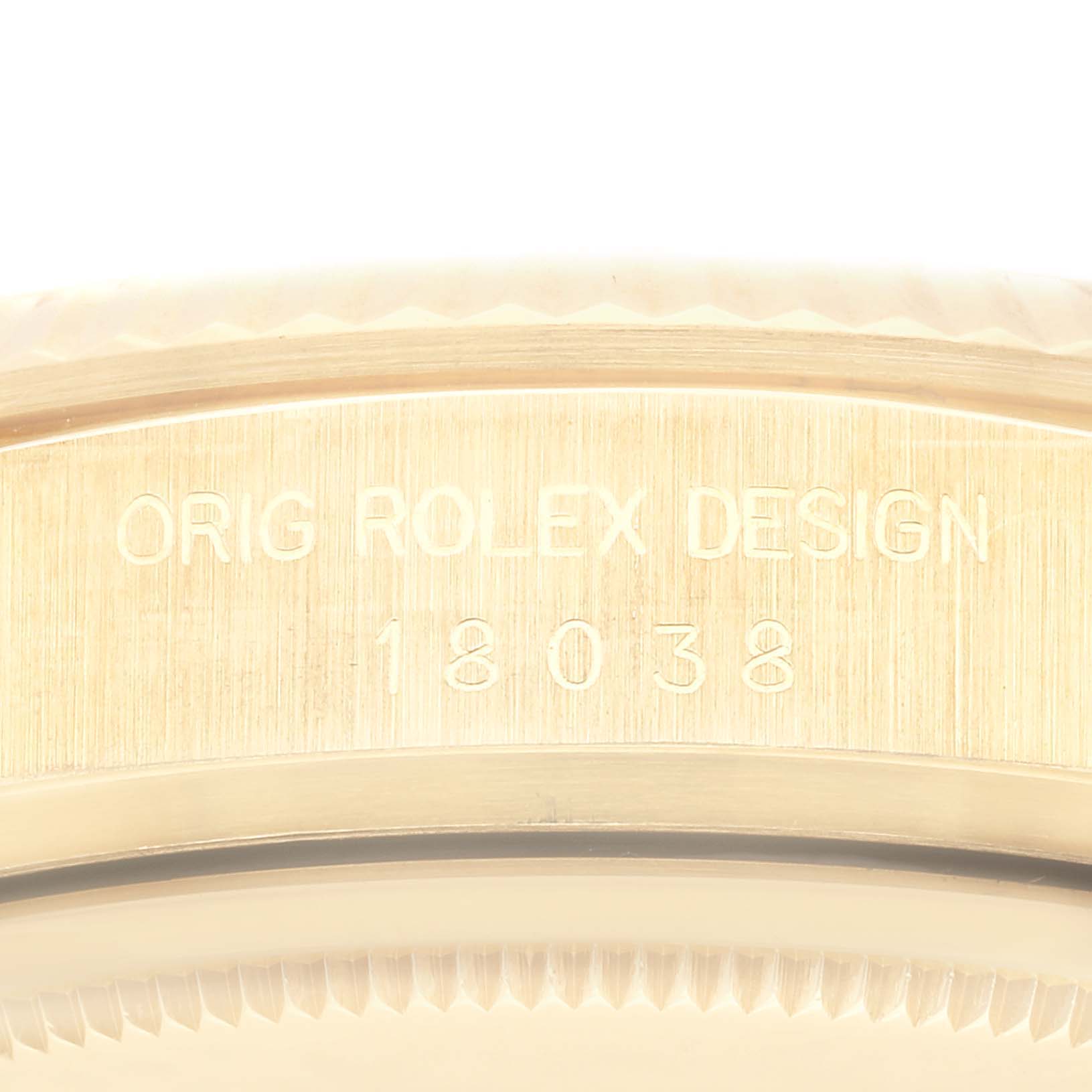 This image shows the engraved serial number and design text on the side of a Rolex President 18038 Men
s Yellow Gold Champagne Dial 18038 Men
s Yellow Gold Champagne Dial model watch case.