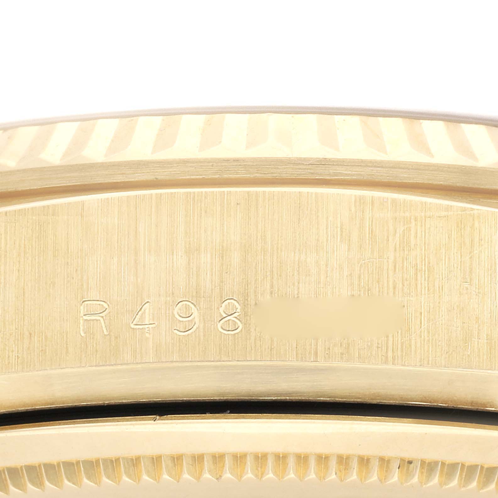 This image shows the engraved side of the case on a Rolex President 18038 Men
s Yellow Gold Champagne Dial 18038 Men
s Yellow Gold Champagne Dial model watch.
