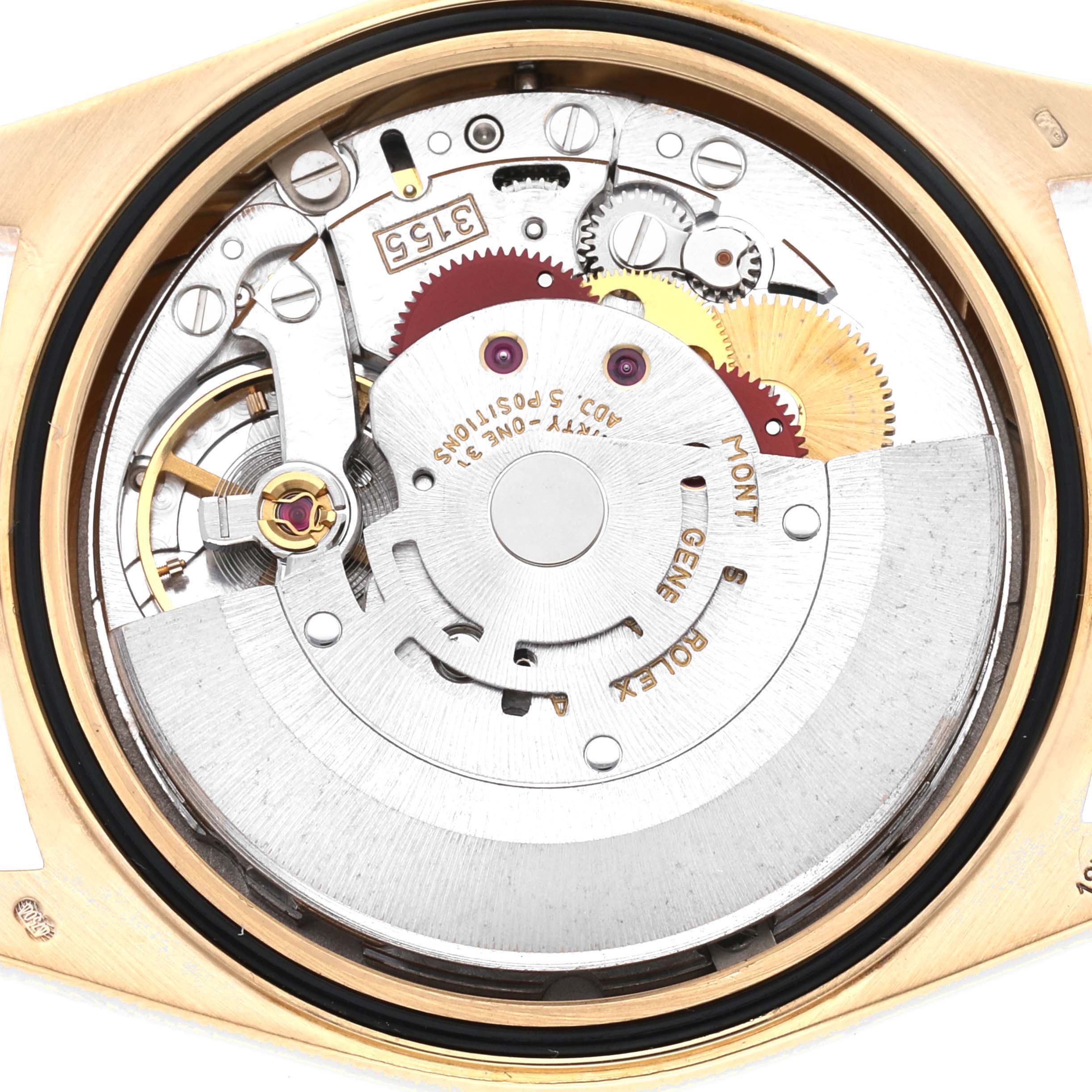 This image shows the intricate internal mechanism of a Rolex President 18238 Men
s Yellow Gold Champagne Dial 18238 Men
s Yellow Gold Champagne Dial watch, focusing on the movement and gears.