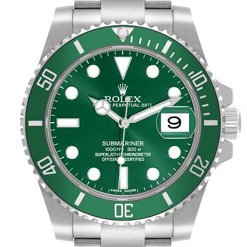 The Rolex Submariner watch is shown from a top-down angle, featuring the green dial, bezel, and part of the bracelet.