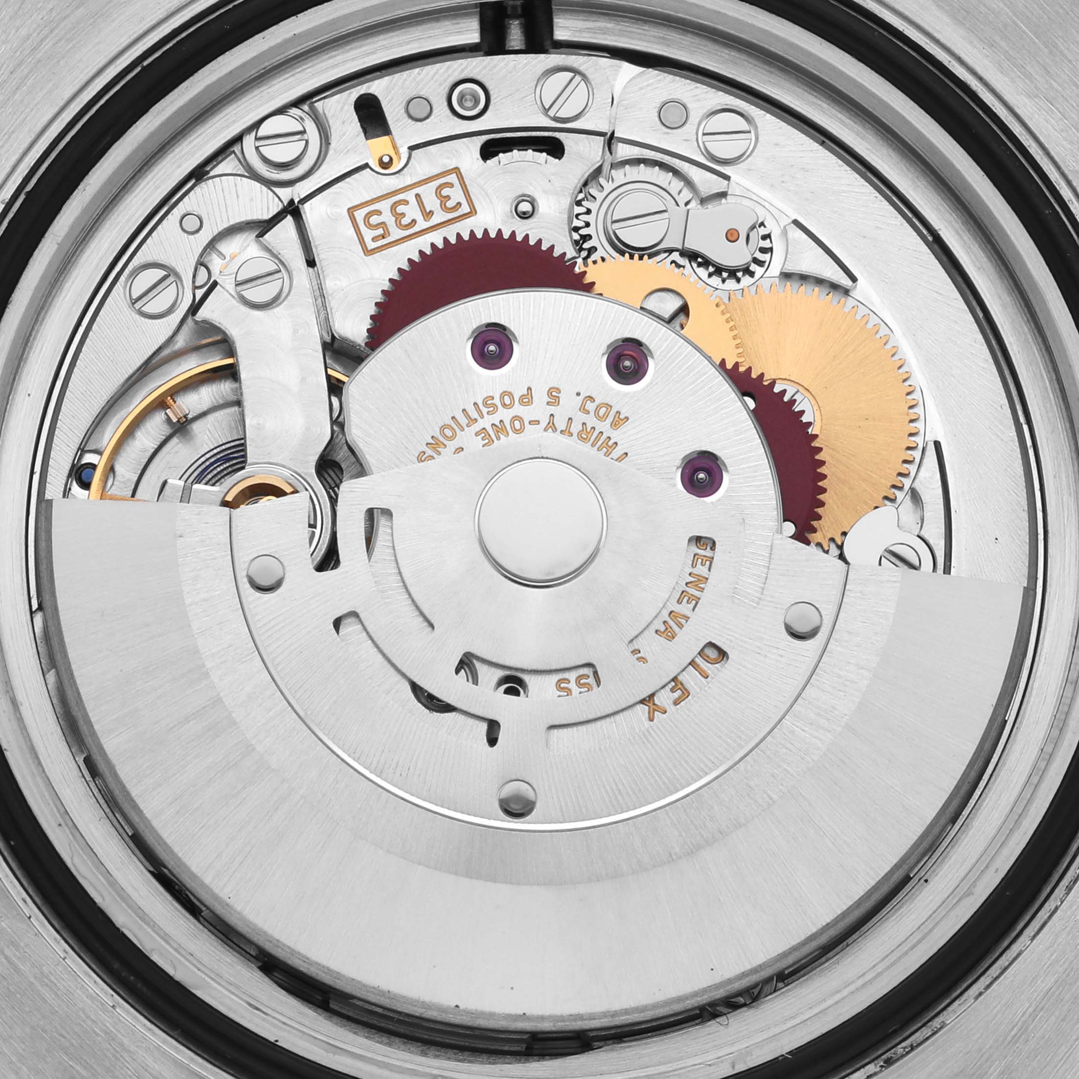 The image shows the movement of a Rolex Submariner 116610LV Men's Stainless Steel Green Dial 116610LV Men's Stainless Steel Green Dial watch, highlighting gears and the rotor from a top-down angle.
