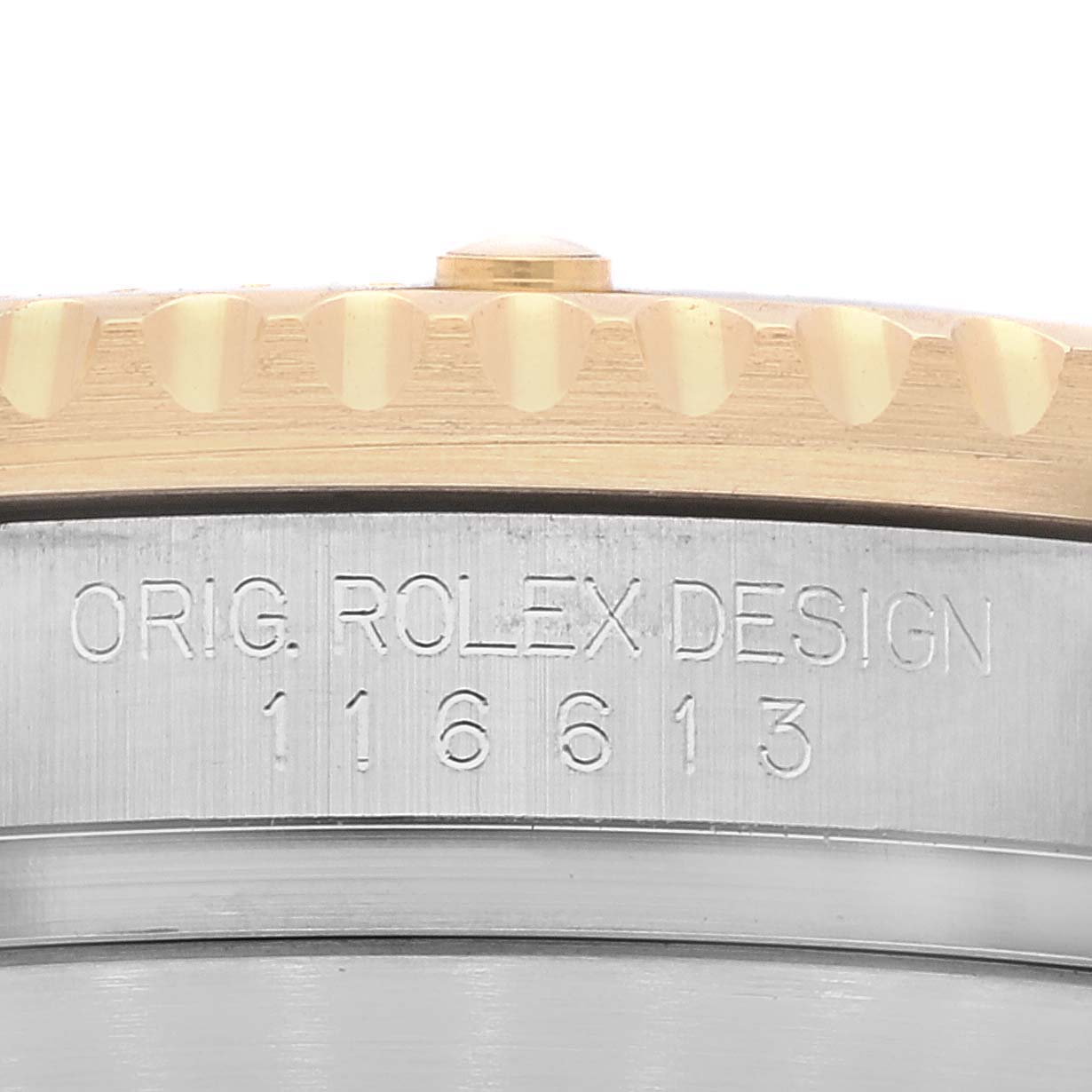 This image shows a close-up of the case side and bezel of a Rolex Submariner 116613 Men's Steel and Gold (two tone) Black Dial 116613 Men's Steel and Gold (two tone) Black Dial, highlighting the serial number and "ORIG. ROLEX DESIGN" engraving.
