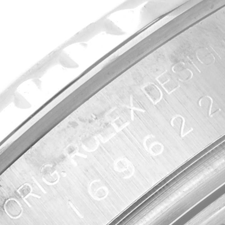 The image shows a close-up of the engraved case or bezel of a Rolex Yacht-Master 169622 Women
s Stainless Steel Silver Dial 169622 Women
s Stainless Steel Silver Dial watch.