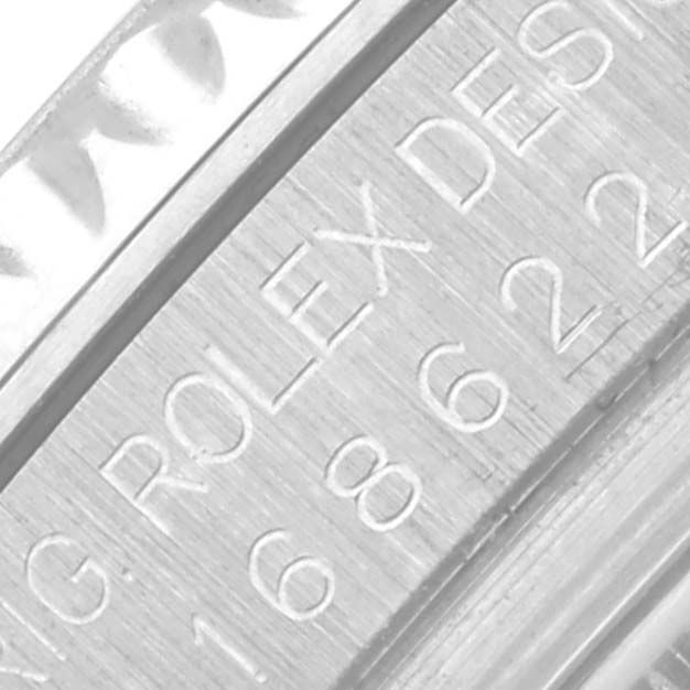 The image shows a close-up of the Rolex Yacht-Master 168622 Men
s Stainless Steel Silver Dial 168622 Men
s Stainless Steel Silver Dial watch engravings on the case edge.