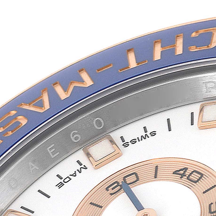 The image shows a close-up angle of the Rolex Yacht-Master 116681 Men's Steel and Gold (two tone) White Dial 116681 Men's Steel and Gold (two tone) White Dial watch bezel and part of the dial.