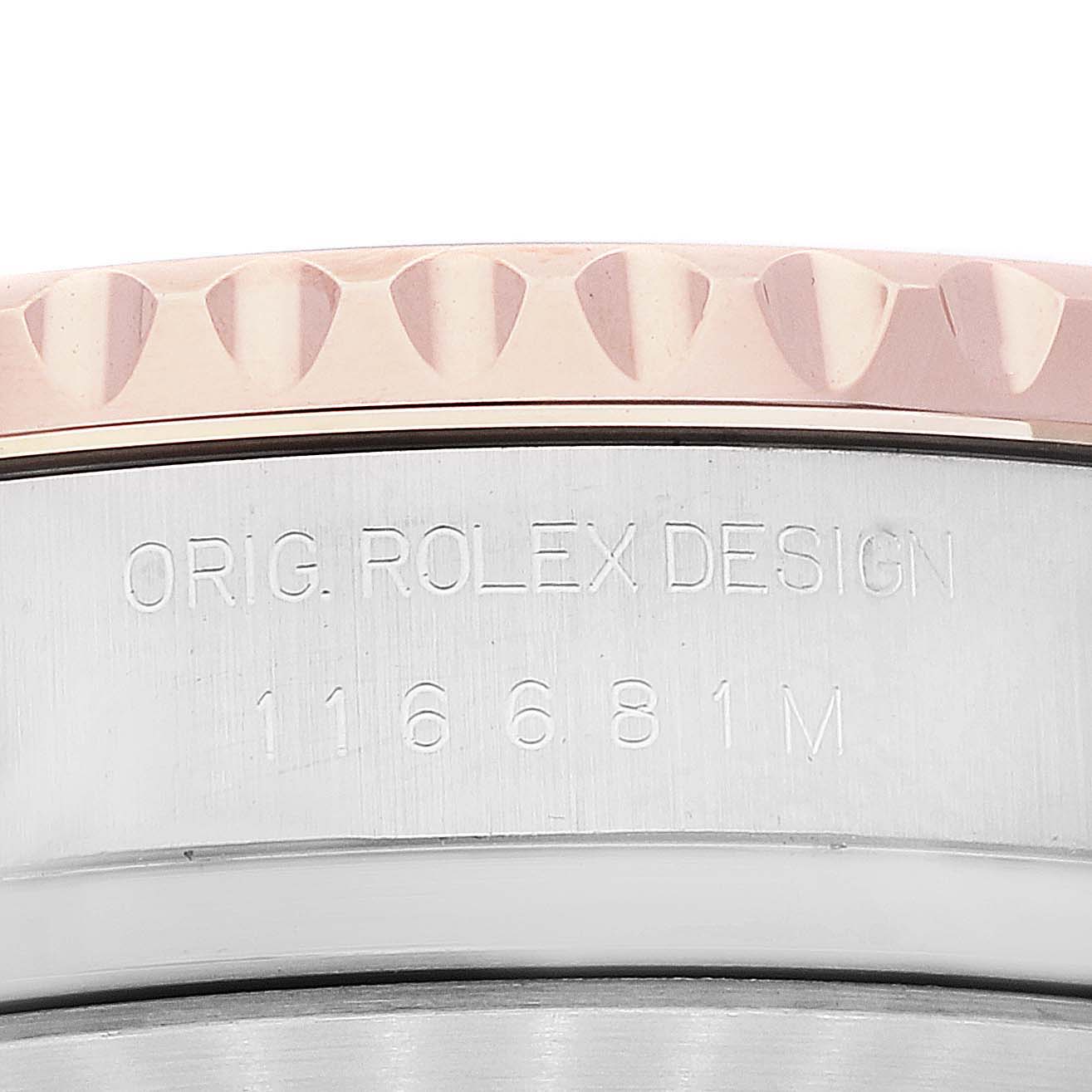 This close-up image shows the engraved side of a Rolex Yacht-Master 116681 Men's Steel and Gold (two tone) White Dial 116681 Men's Steel and Gold (two tone) White Dial watch, displaying the model number and bezel.