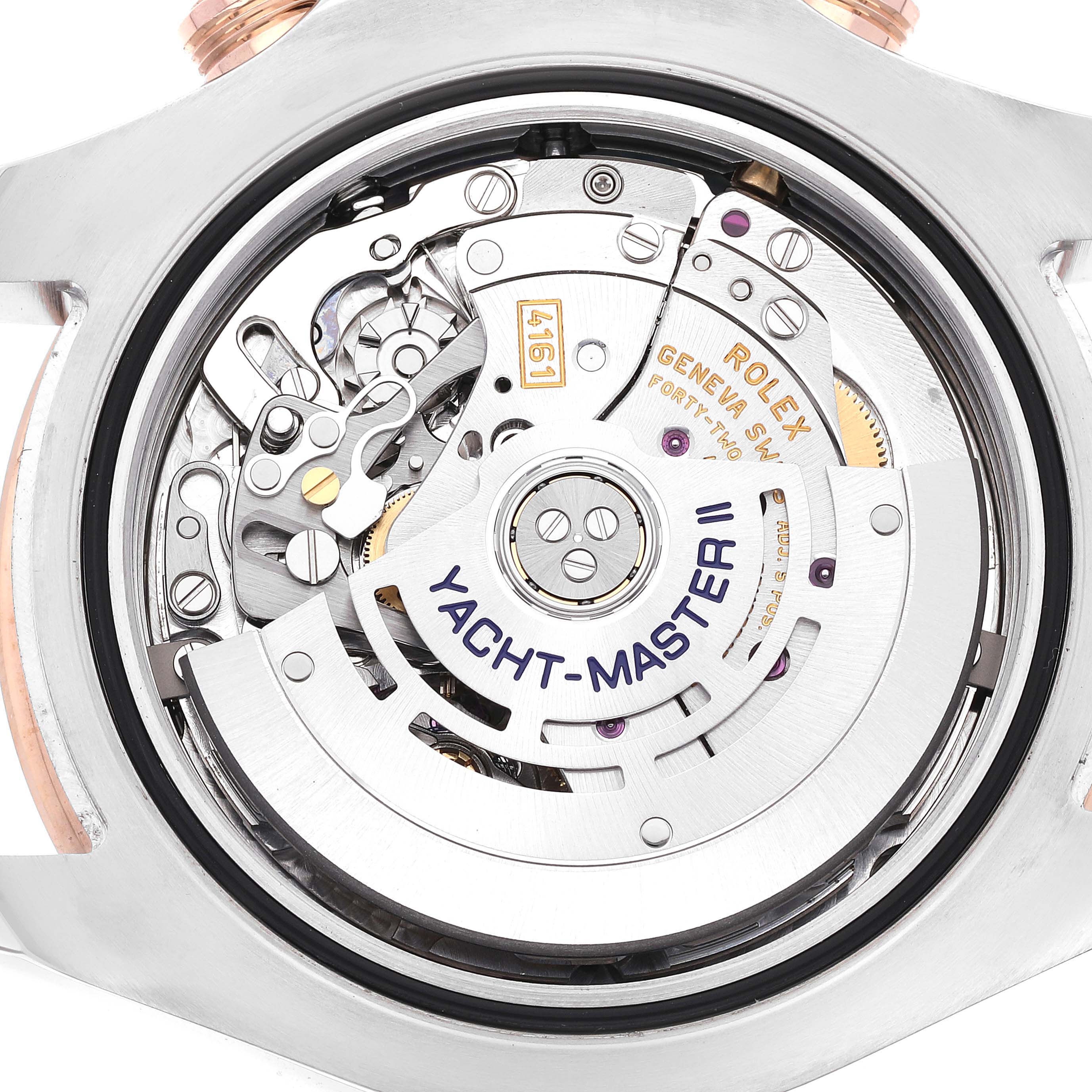 The image shows the back view of a Rolex Yacht-Master 116681 Men's Steel and Gold (two tone) White Dial 116681 Men's Steel and Gold (two tone) White Dial model, revealing its intricate mechanical movement.