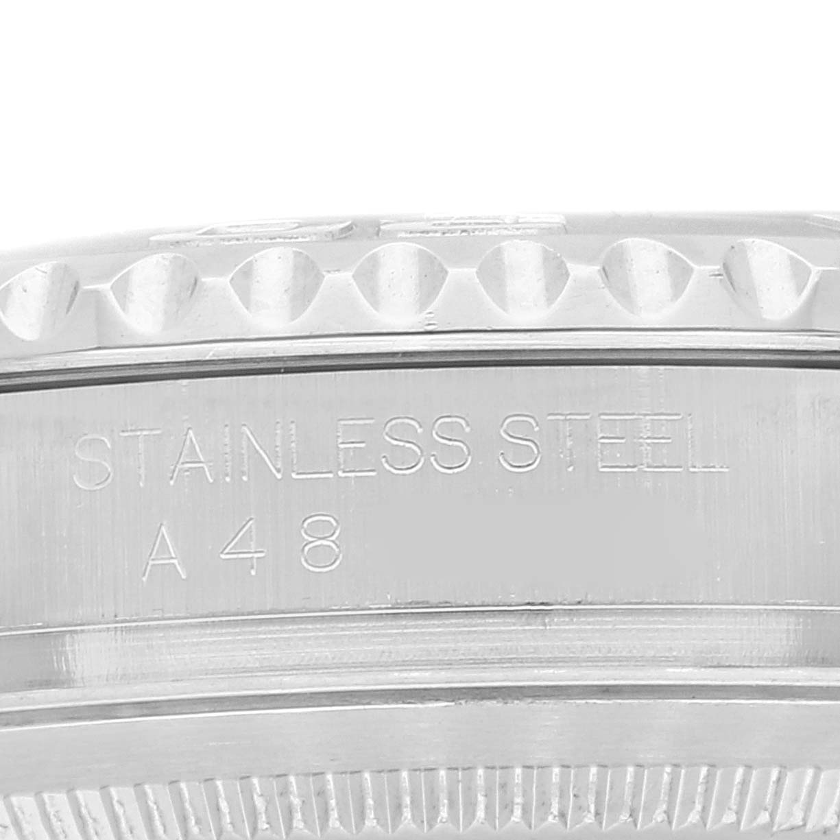 This close-up image shows the side of the stainless steel case of the Rolex Yacht-Master 16622 Men's Stainless Steel Silver Dial 16622 Men's Stainless Steel Silver Dial watch, featuring the textured bezel and engraved markings.
