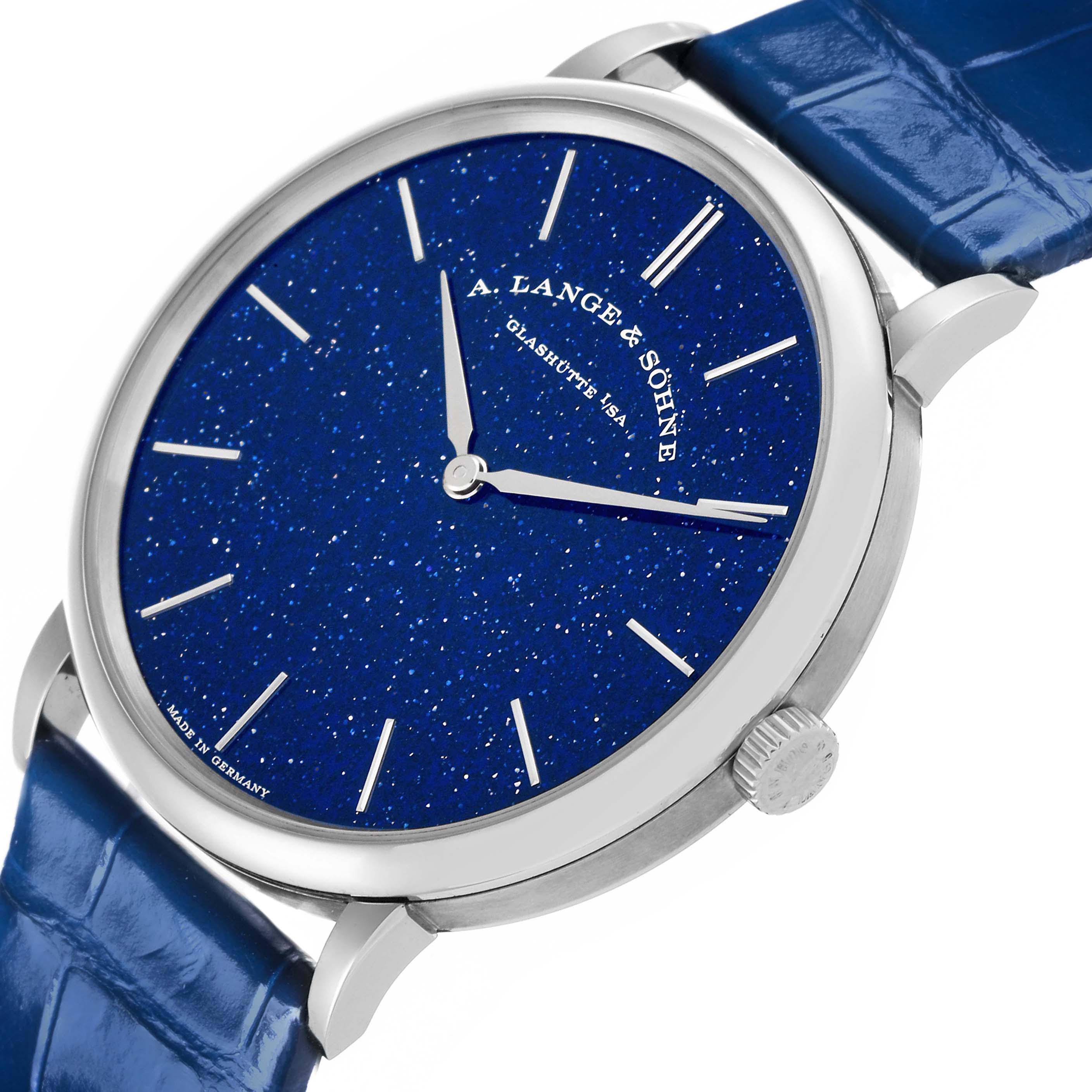 The image shows an angled view of the Saxonia by A. Lange & Söhne, highlighting the blue dial, silver indices, case, and crown.