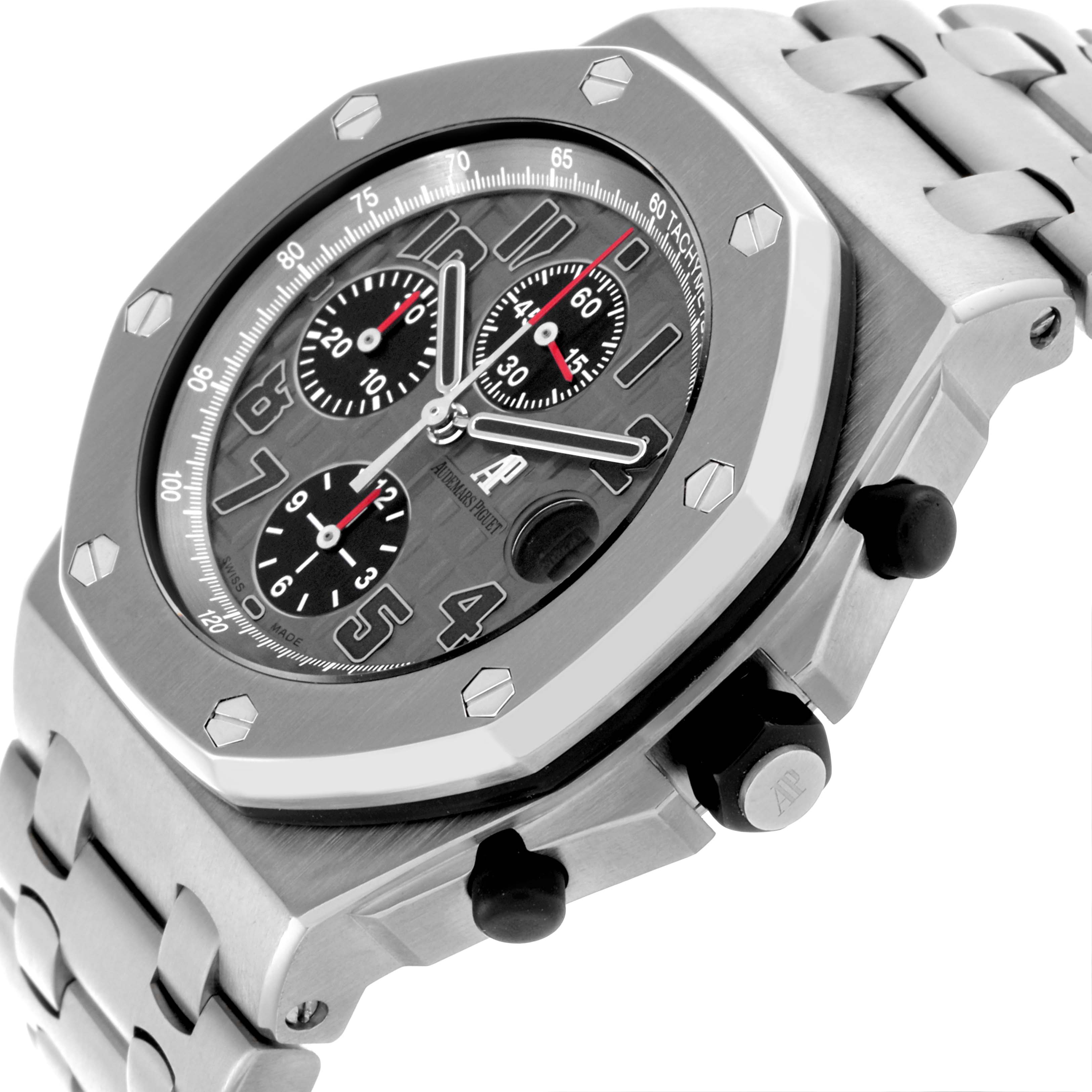 The image shows a side angle of the Audemars Piguet Royal Oak Offshore 26170TI.OO.1000TI.01 Men's Titanium Grey Dial 26170TI.OO.1000TI.01 Men's Titanium Grey Dial watch, highlighting the bezel, dial, and pushers.