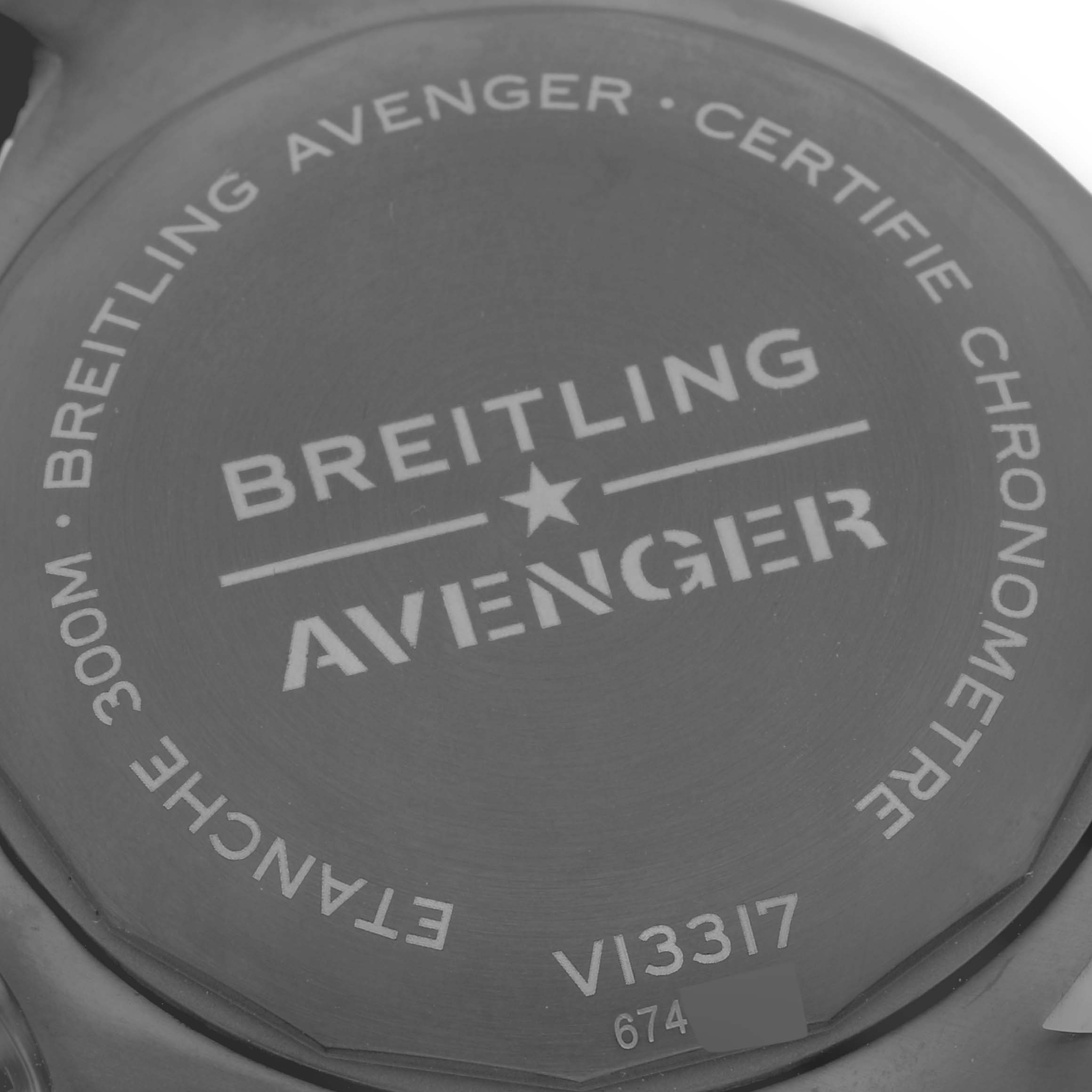 The image shows the back case of a Breitling Avenger V13317101L1X1 Men's Titanium Green Dial V13317101L1X1 Men's Titanium Green Dial watch, including model engraving and water resistance details.