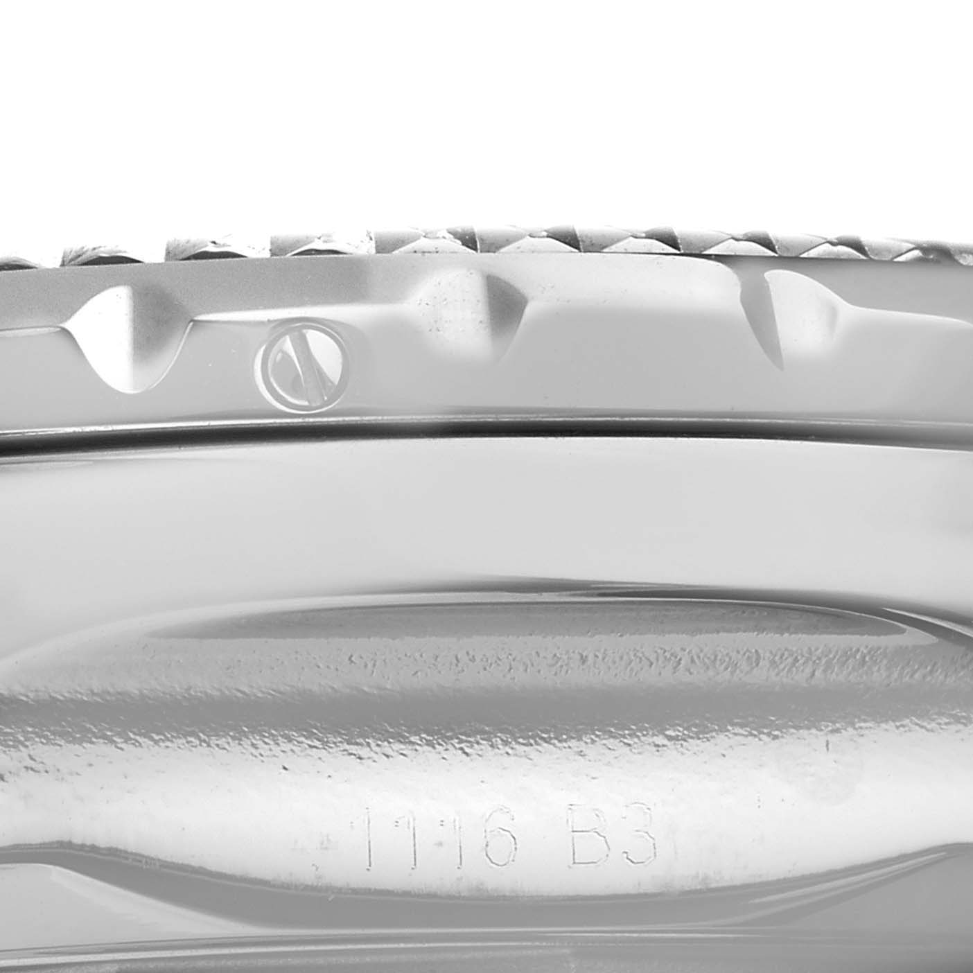 The image shows a close-up view of the bezel and side of the Bentley model watch by Breitling, including a screw and a part number engraving.
