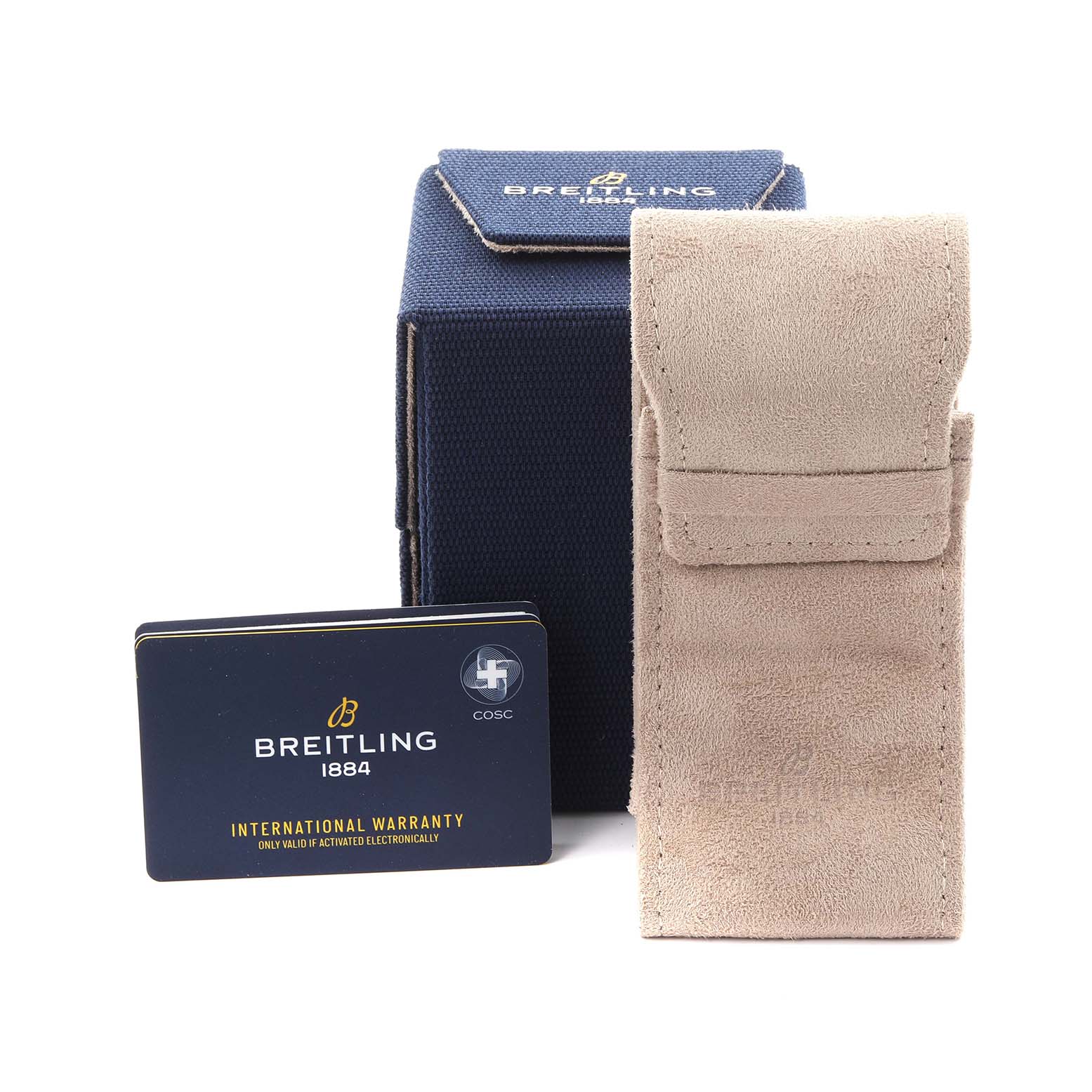 The image shows a Breitling Superocean M17368 Men's Stainless Steel Black Dial M17368 Men's Stainless Steel Black Dial warranty card, a blue box, and a beige suede pouch from a front angle.