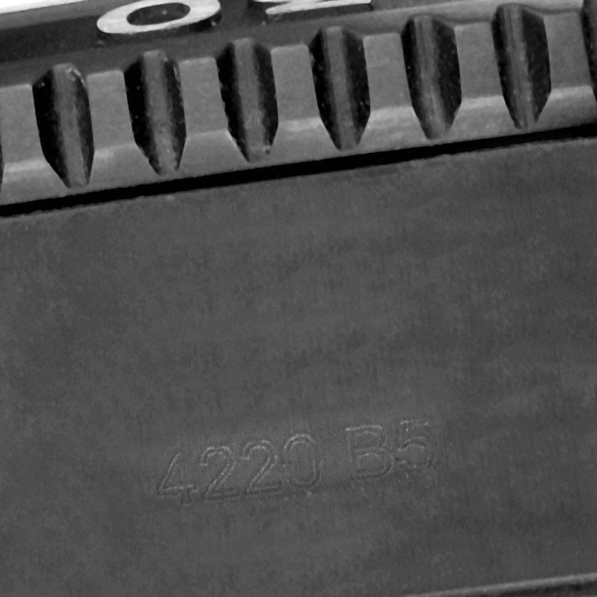 The image shows a close-up of the Breitling Superocean M17368 Men's Stainless Steel Black Dial M17368 Men's Stainless Steel Black Dial's bezel and strap with the code "4220 B5" visible.