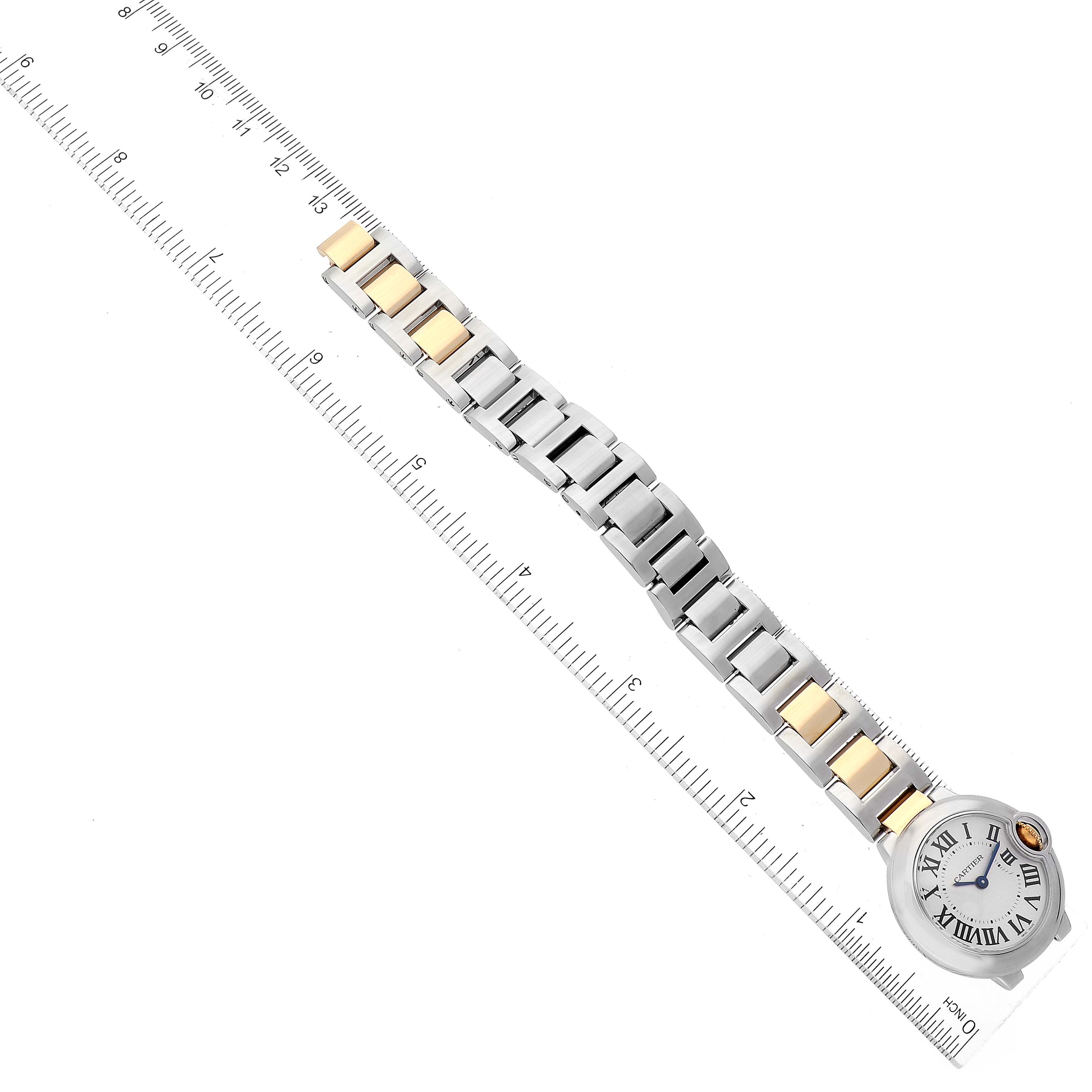 This image shows a Cartier Ballon Bleu W69007Z3 Women
s Steel and Gold (two tone) Silver Dial W69007Z3 Women
s Steel and Gold (two tone) Silver Dial watch laid flat with the full bracelet visible against a ruler for measurement.