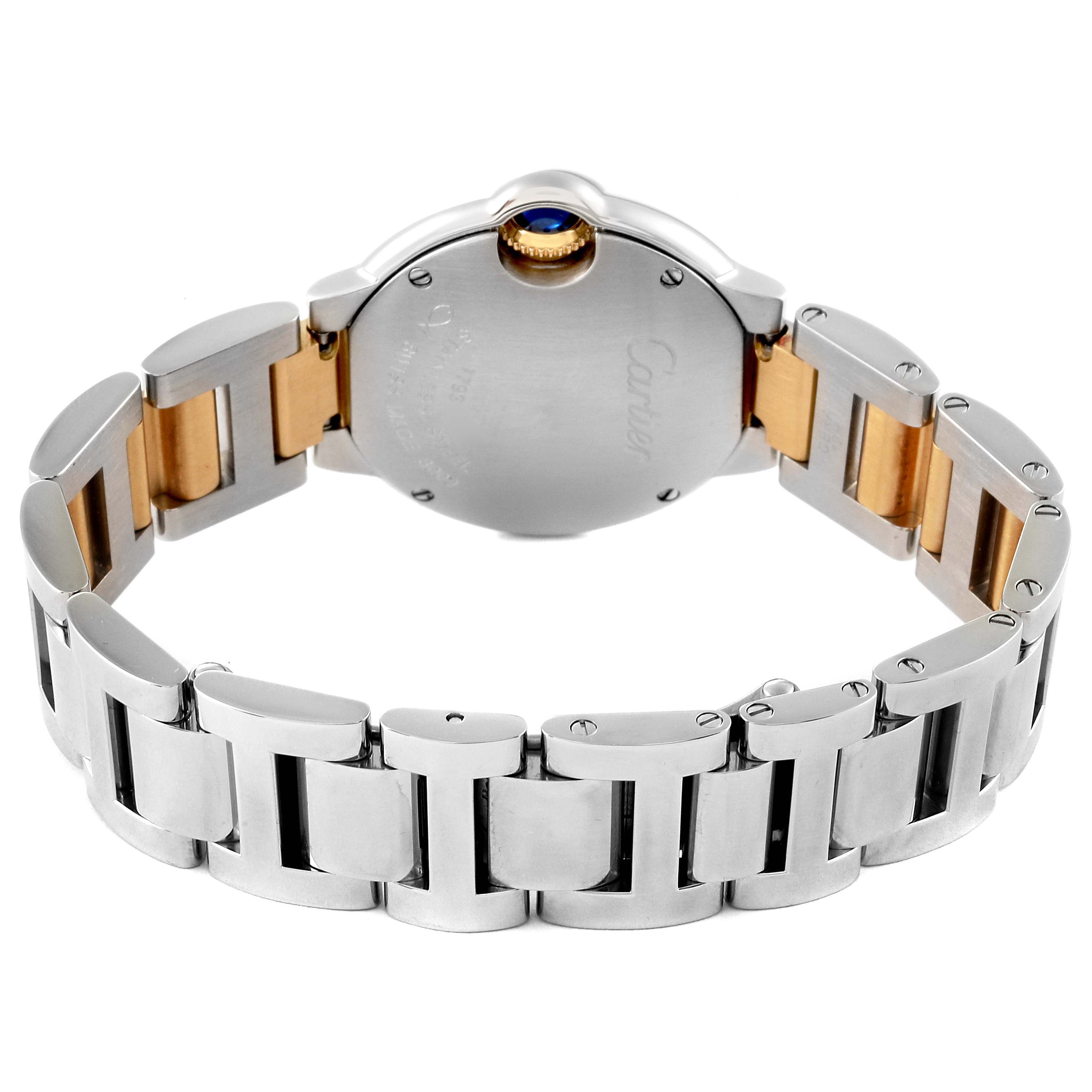 The image shows the back and bracelet of the Ballon Bleu model by Cartier, highlighting its two-tone metal construction and round case.