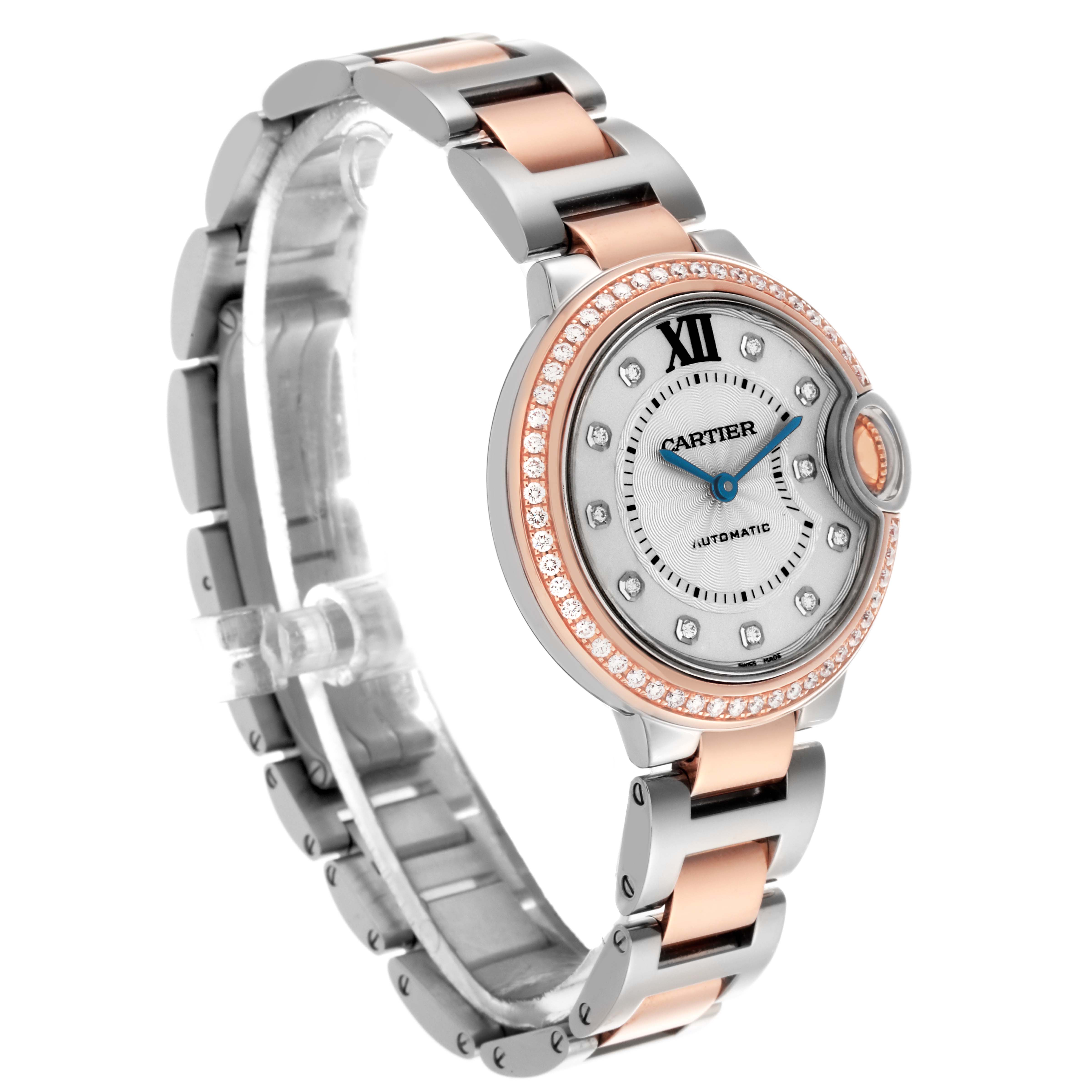 The Cartier Ballon Bleu WE902077 Women
s Steel and Gold (two tone) Silver Dial WE902077 Women
s Steel and Gold (two tone) Silver Dial watch is shown at a three-quarter angle, highlighting the two-tone bracelet, diamond bezel, and dial.