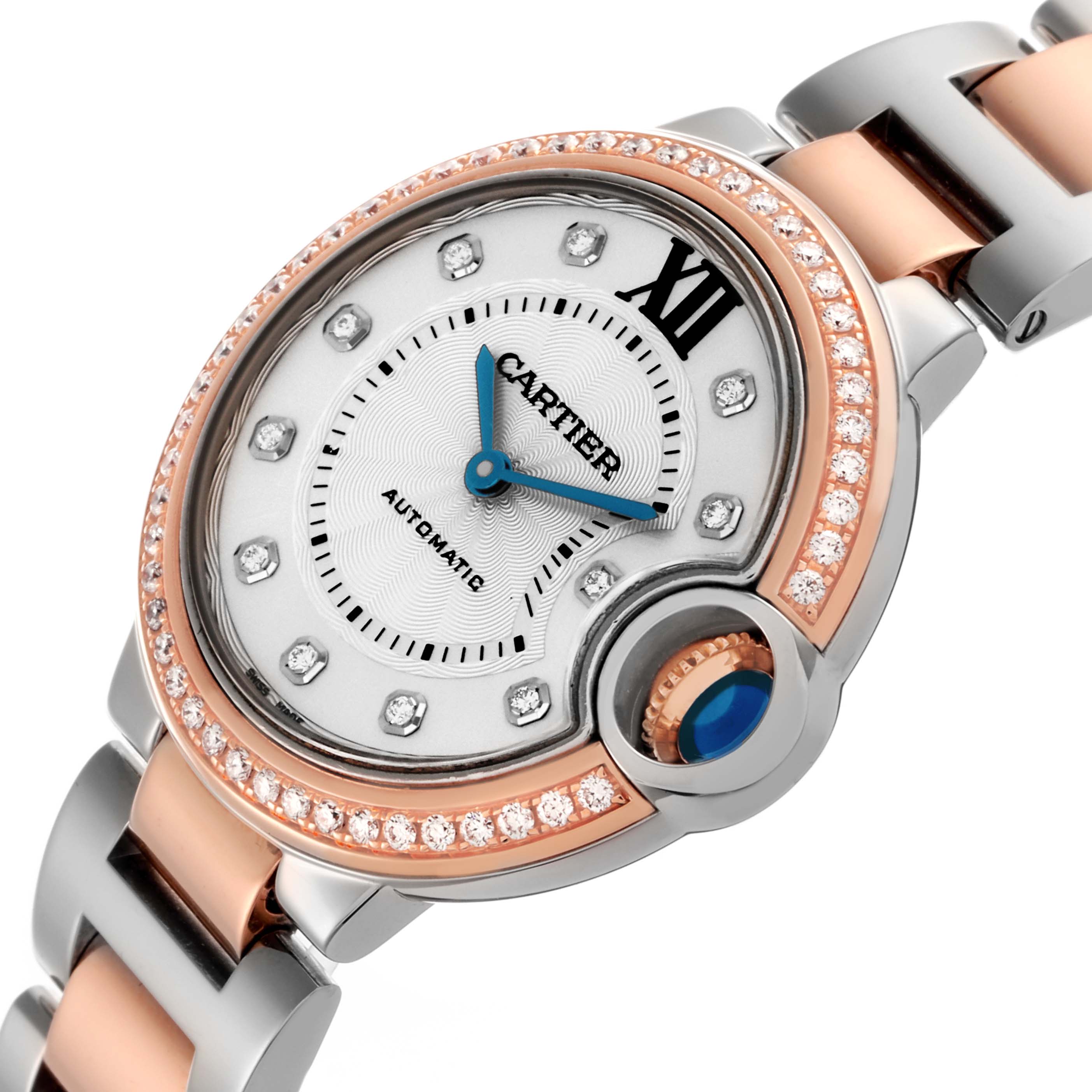The Cartier Ballon Bleu WE902077 Women
s Steel and Gold (two tone) Silver Dial WE902077 Women
s Steel and Gold (two tone) Silver Dial watch is shown from a top angle, highlighting the face, bezel, and part of the bracelet.