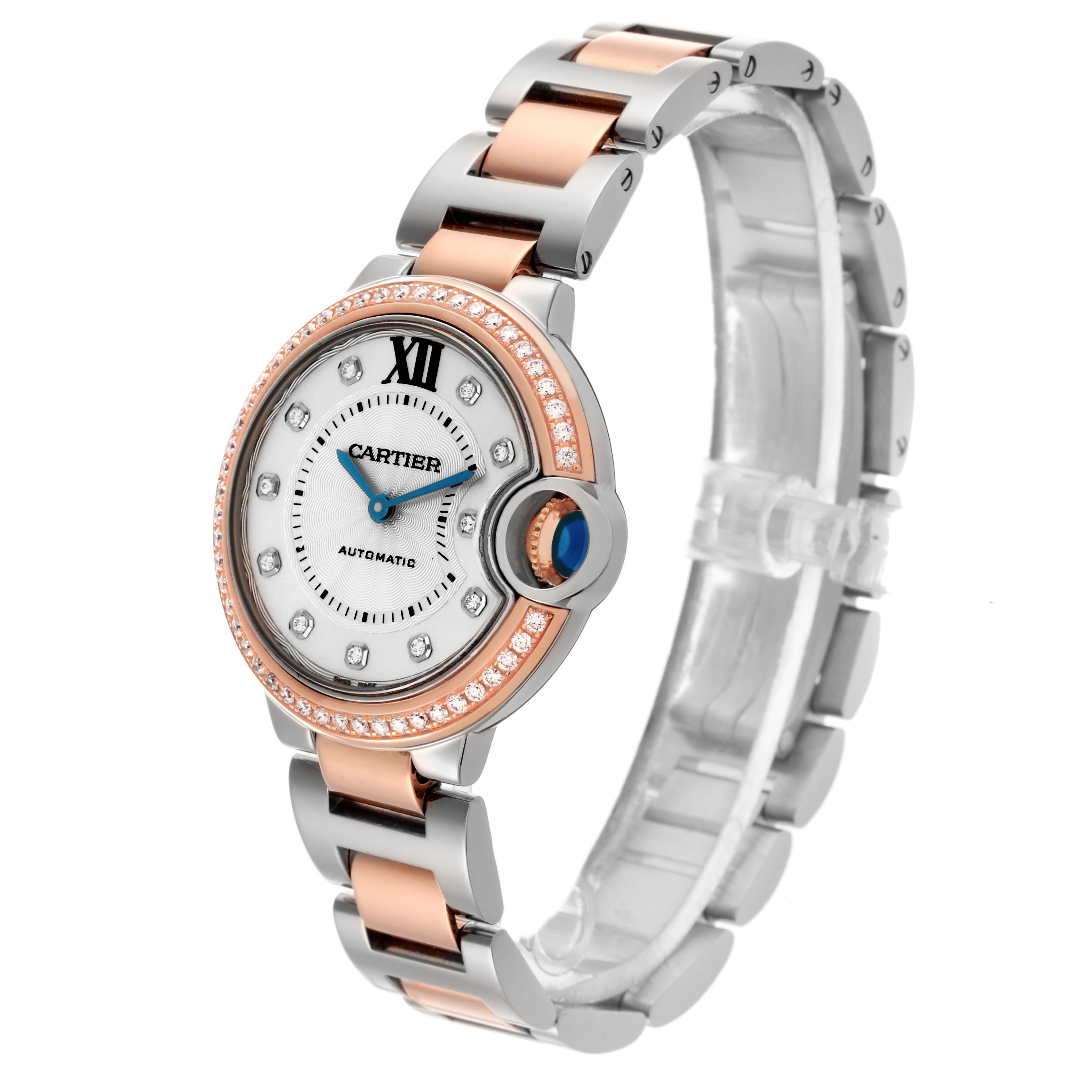 The Cartier Ballon Bleu WE902077 Women
s Steel and Gold (two tone) Silver Dial WE902077 Women
s Steel and Gold (two tone) Silver Dial watch is shown at an angle displaying the face, bezel, crown, and bracelet.