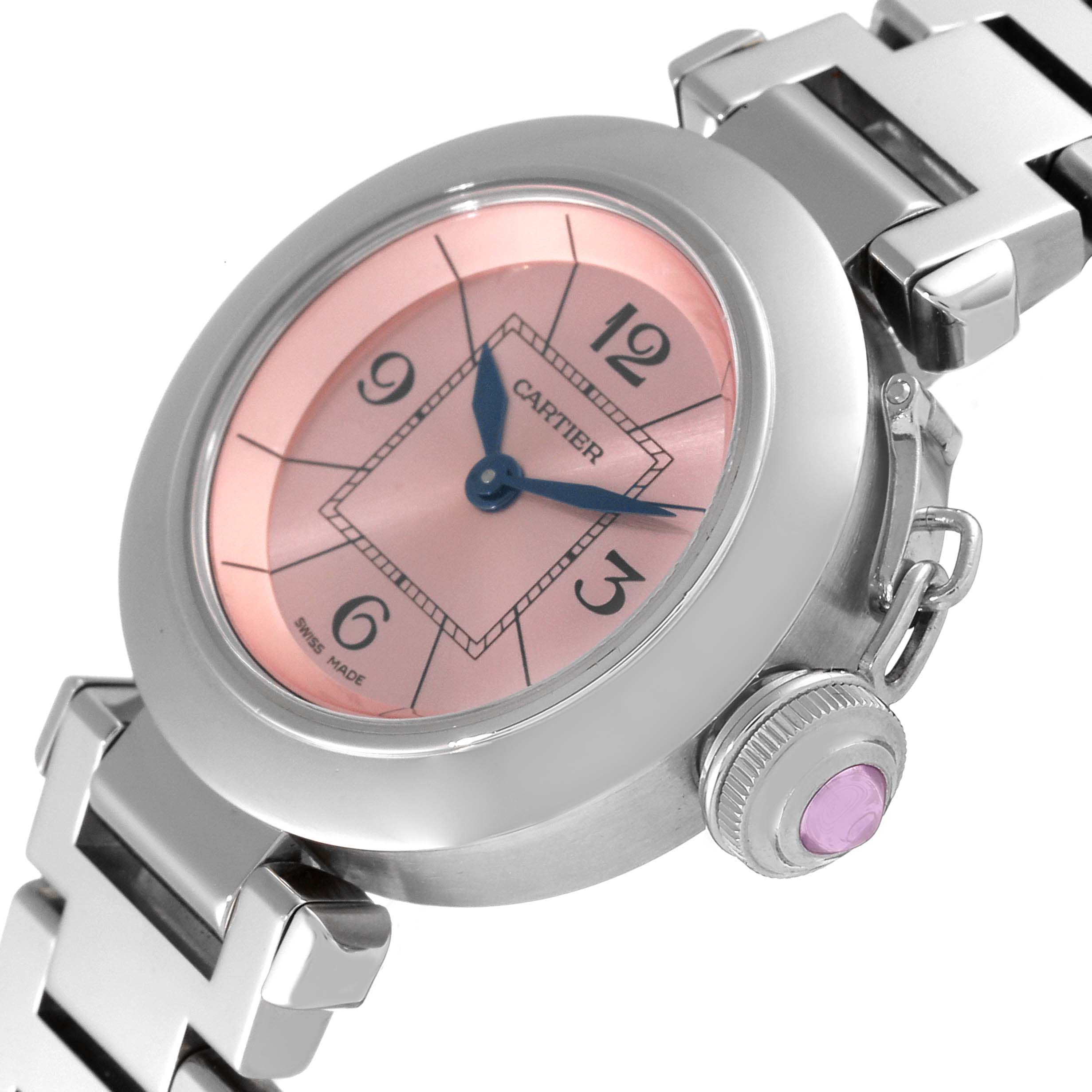 The Cartier Pasha W3140008 Women's Stainless Steel Pink Dial W3140008 Women's Stainless Steel Pink Dial watch is shown at a tilted angle, highlighting the face, crown, and part of the stainless steel bracelet.