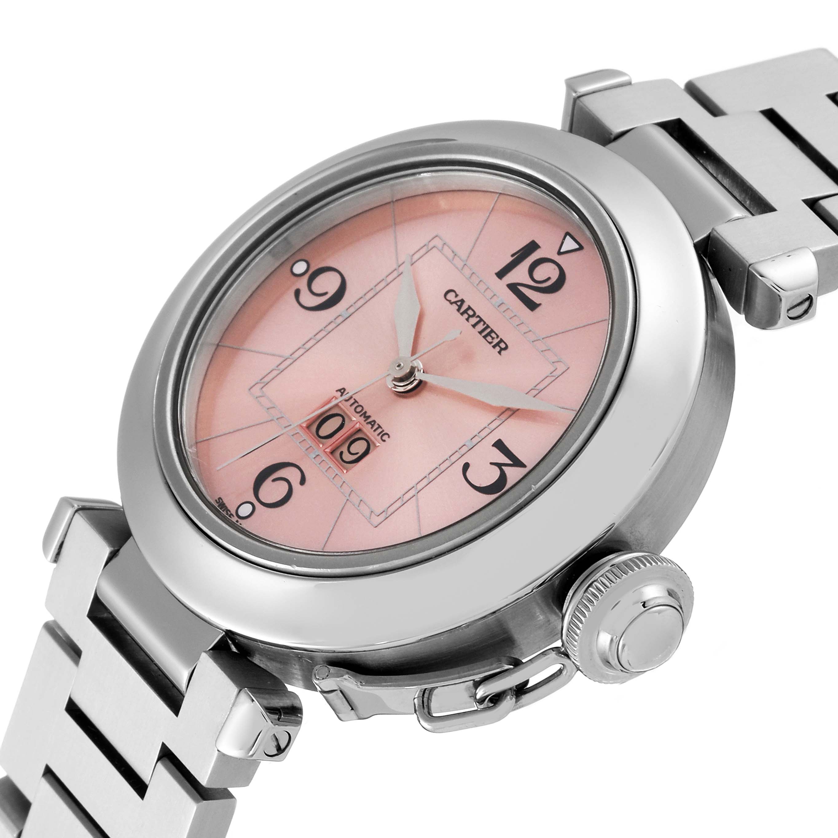 The image shows a close-up, angled view of the Cartier Pasha W31058M7 Women's Stainless Steel Pink Dial W31058M7 Women's Stainless Steel Pink Dial watch face, crown, and part of the stainless steel bracelet.