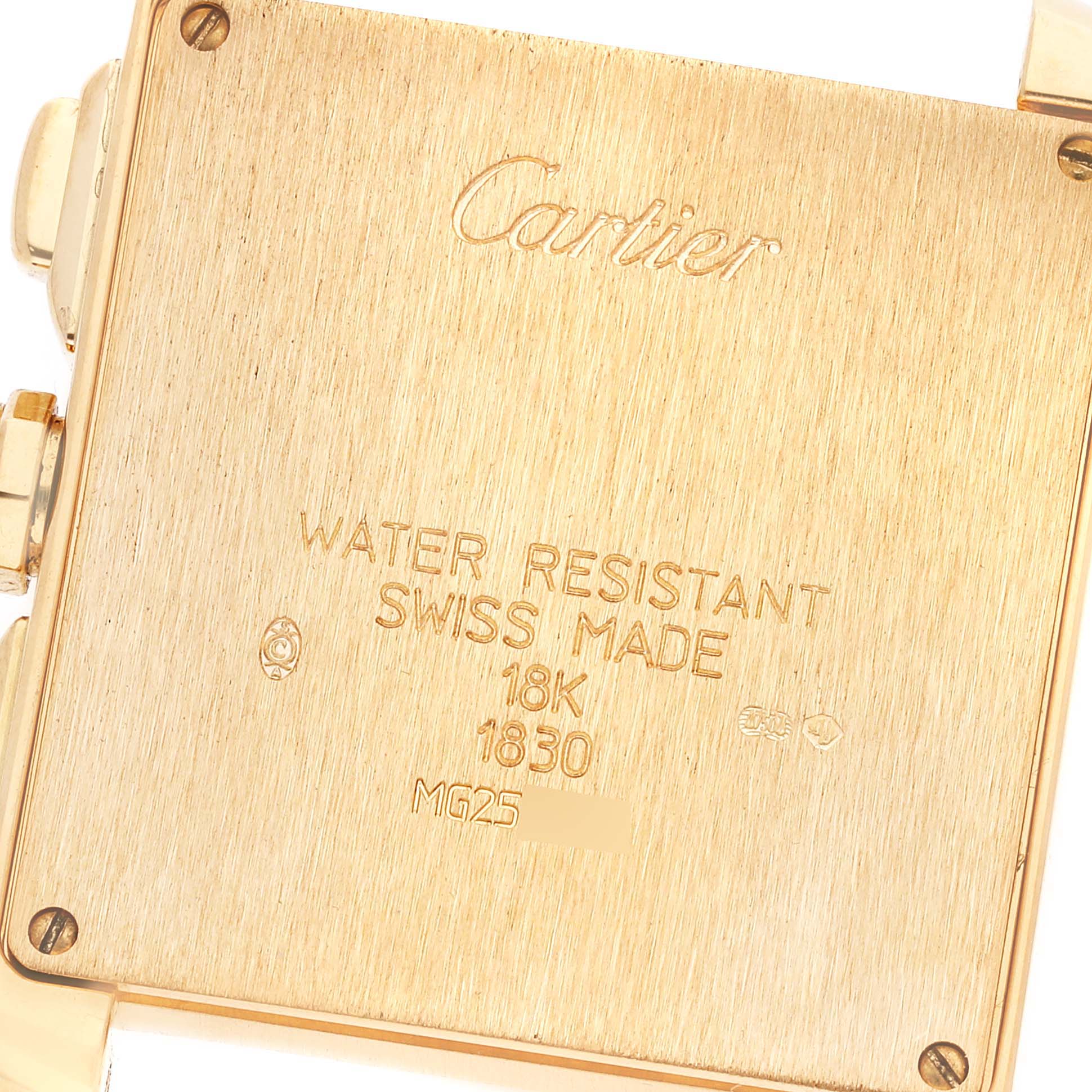 The image shows the engraved case back of a Cartier Tank Francaise W5000556 Men's Yellow Gold Silver Dial W5000556 Men's Yellow Gold Silver Dial watch, highlighting its gold material and specifications.