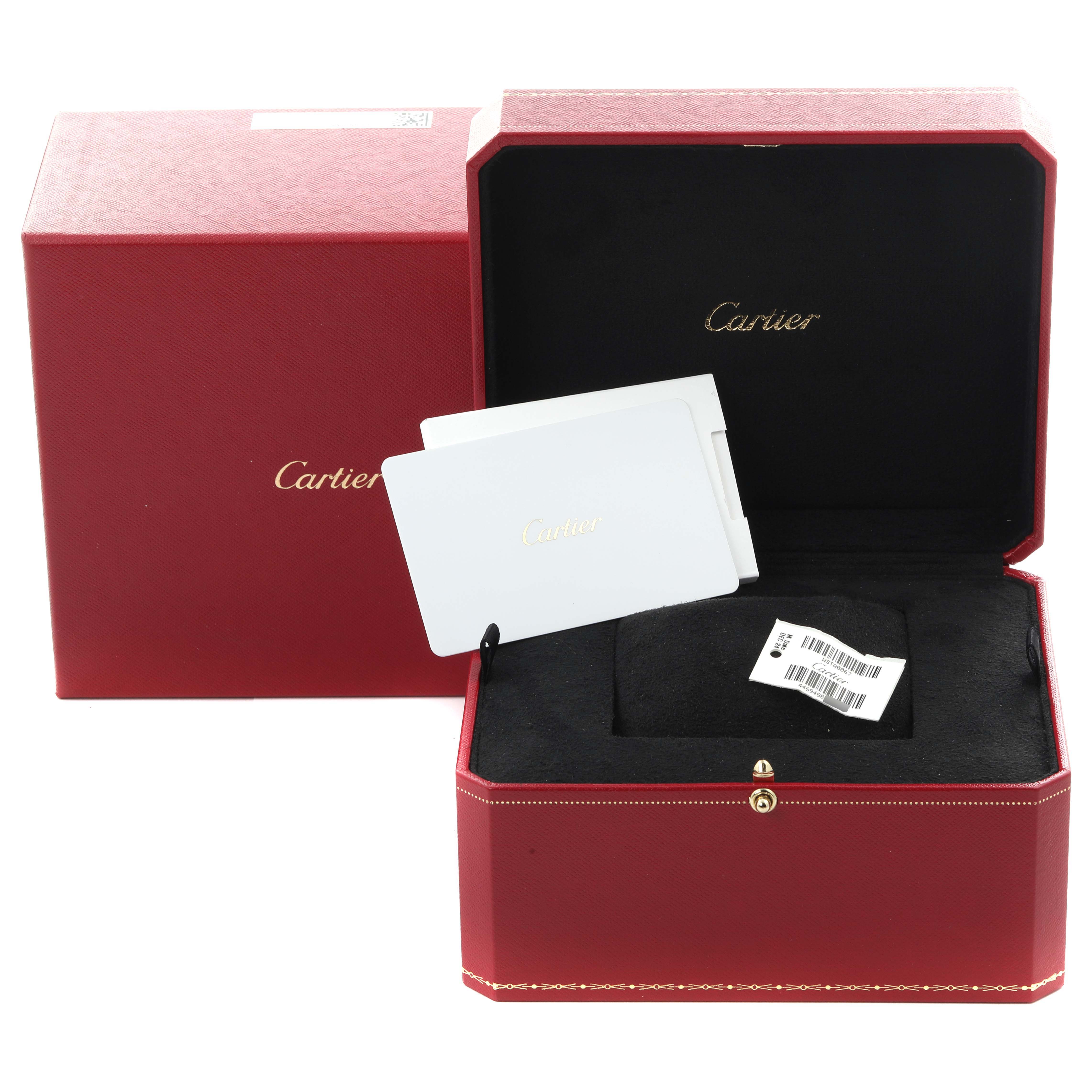 The image shows the packaging for a Cartier Tank Francaise WSTA0067 Men's Stainless Steel Silver Dial WSTA0067 Men's Stainless Steel Silver Dial watch, including a red box, and a booklet.