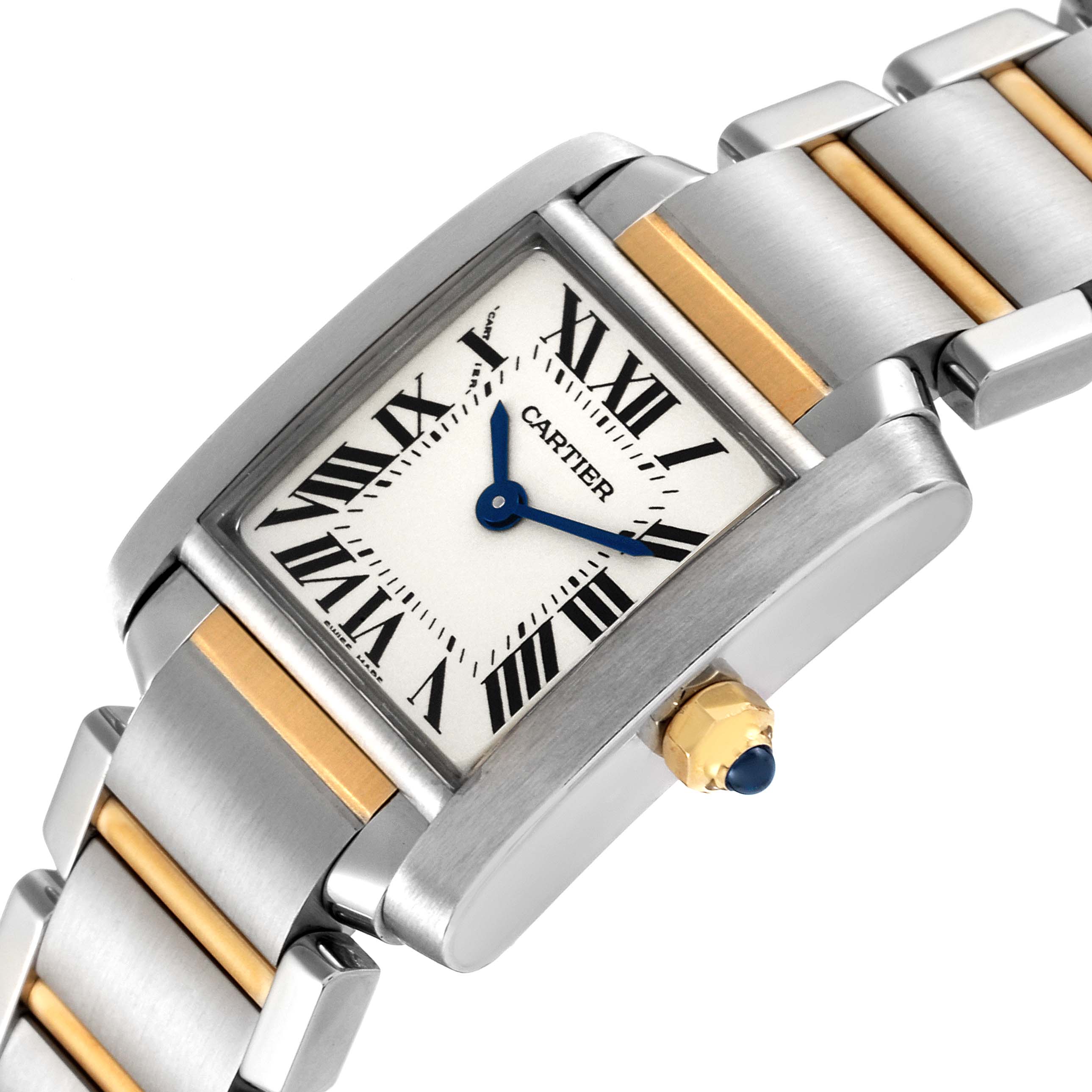 This Tank Francaise watch by Cartier is shown at an angle, highlighting its dial, blue hands, crown, and part of its two-tone band.