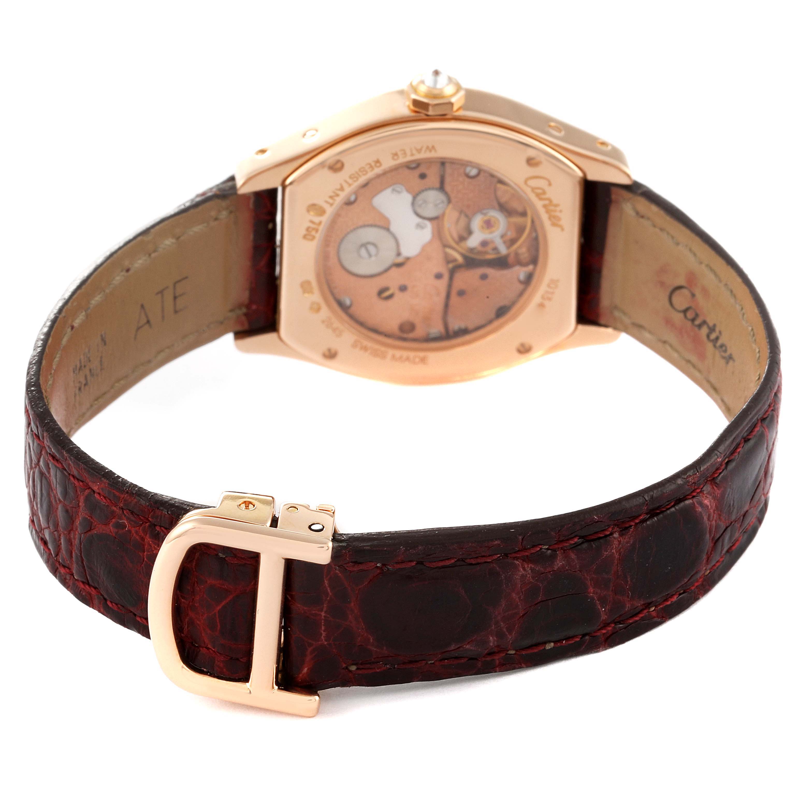 The image shows the back of the Cartier Tortue WA507031 Women's Rose Gold Silver Dial WA507031 Women's Rose Gold Silver Dial watch, featuring its movement and brown leather strap with a gold buckle.