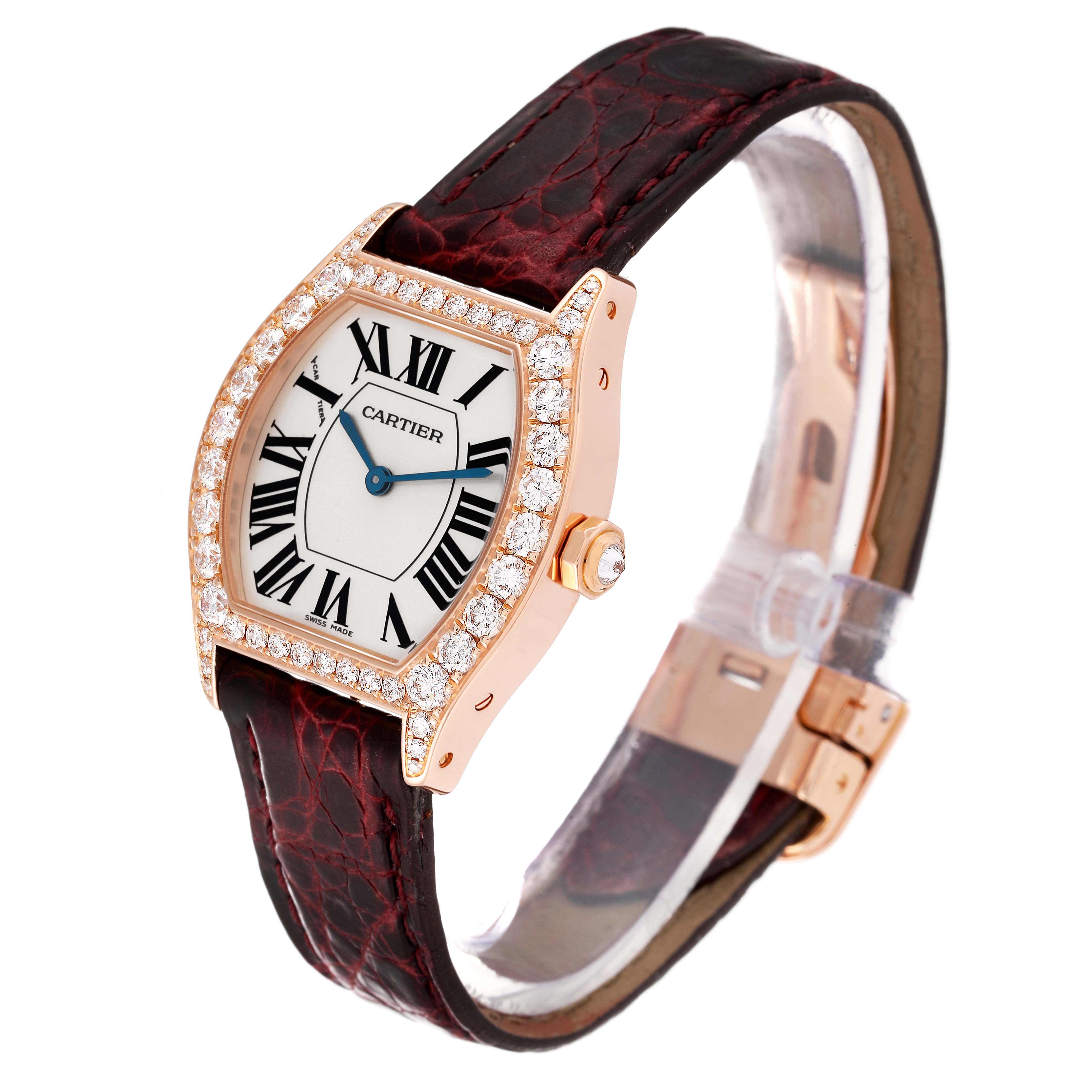 The Cartier Tortue WA507031 Women's Rose Gold Silver Dial WA507031 Women's Rose Gold Silver Dial watch is shown from an angled side view, highlighting the face, bezel, crown, and strap.