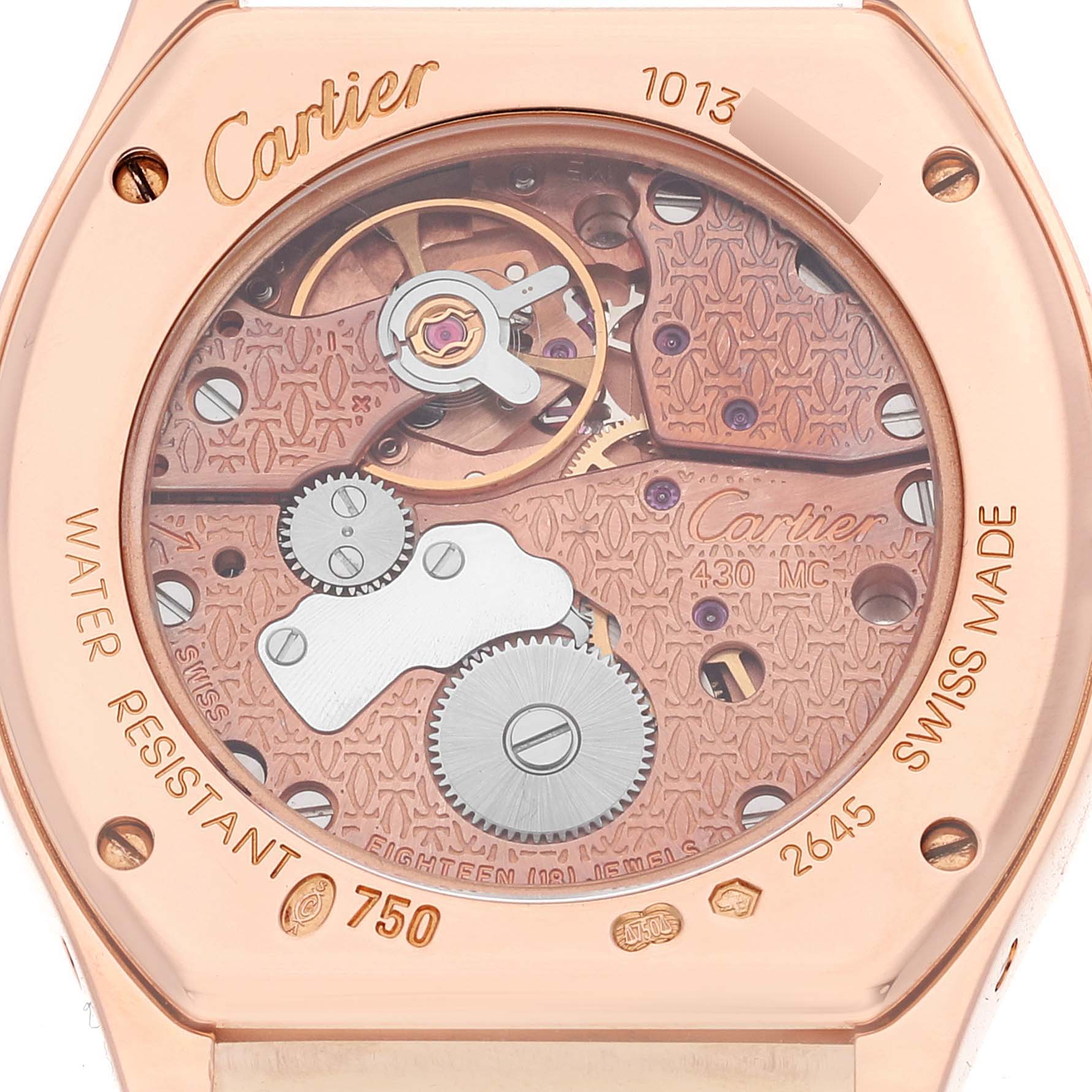 This is a close-up angle showing the intricate inner workings and back case of the Cartier Tortue WA507031 Women's Rose Gold Silver Dial WA507031 Women's Rose Gold Silver Dial watch model.