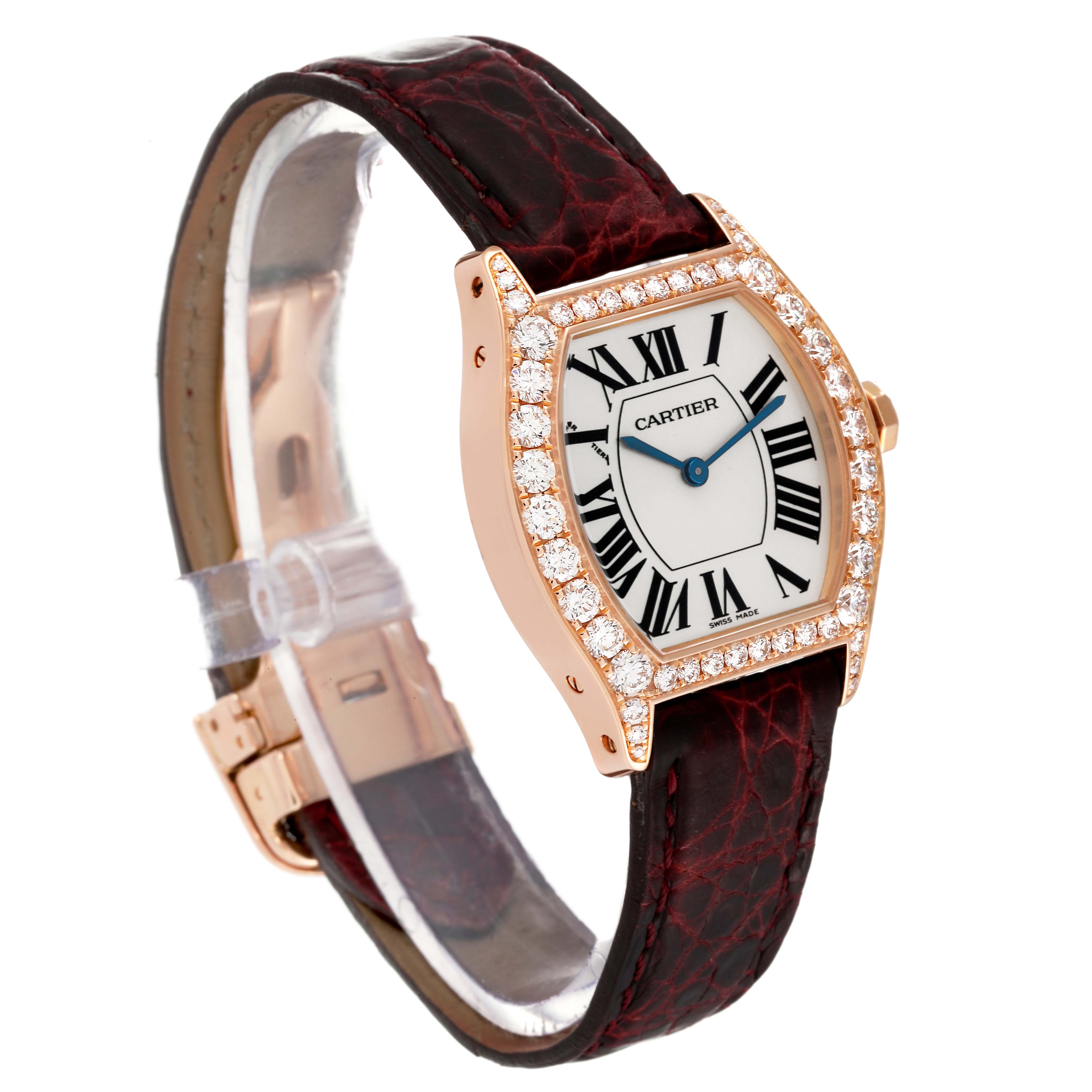 This Cartier Tortue WA507031 Women's Rose Gold Silver Dial WA507031 Women's Rose Gold Silver Dial watch is shown at an angled side view displaying its face, leather strap, and diamond-studded bezel.