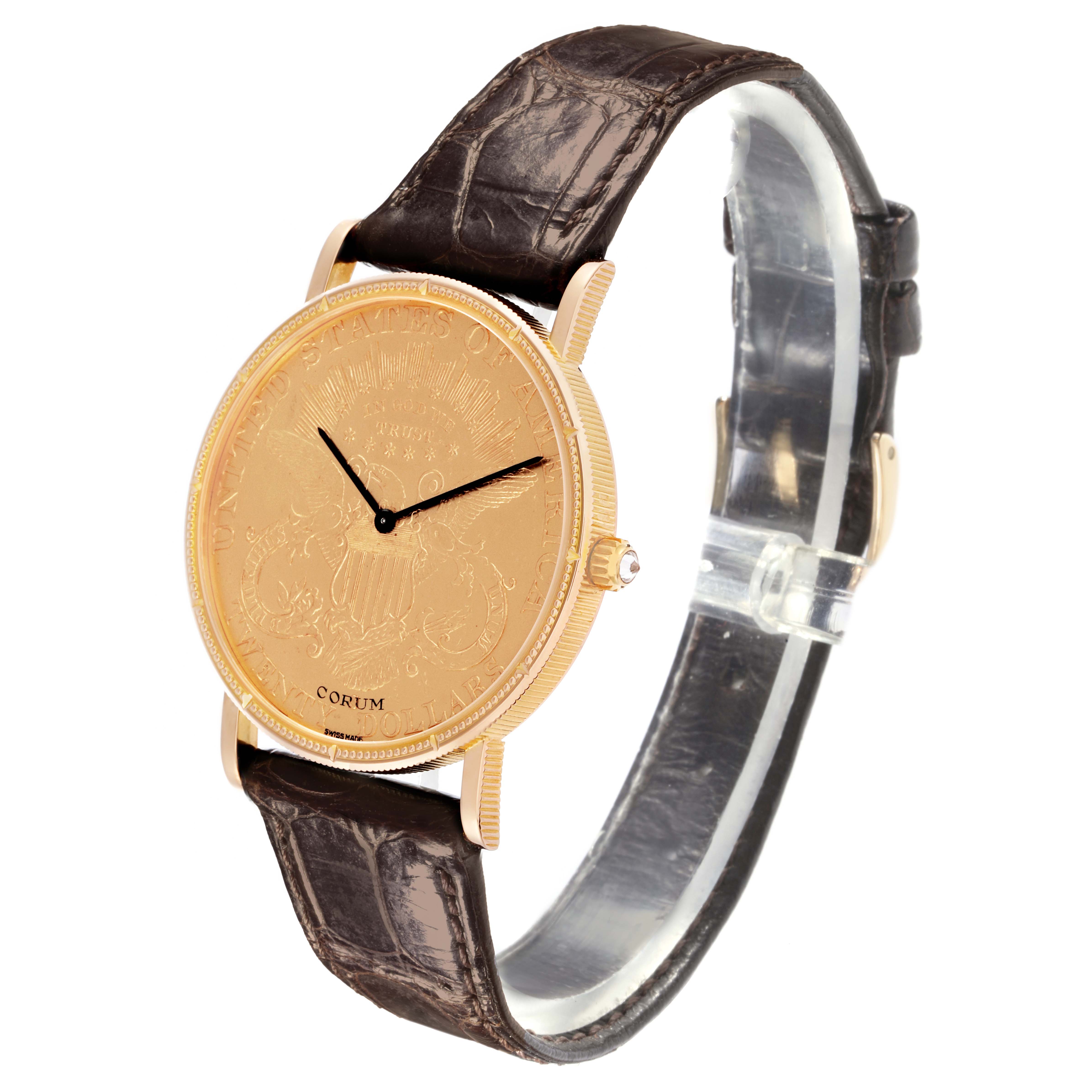 The Corum Coin Watch 4414556 Men's Yellow Gold Champagne Dial 4414556 Men's Yellow Gold Champagne Dial is shown at a three-quarter angle, highlighting its engraved face, gold case, and brown leather strap.