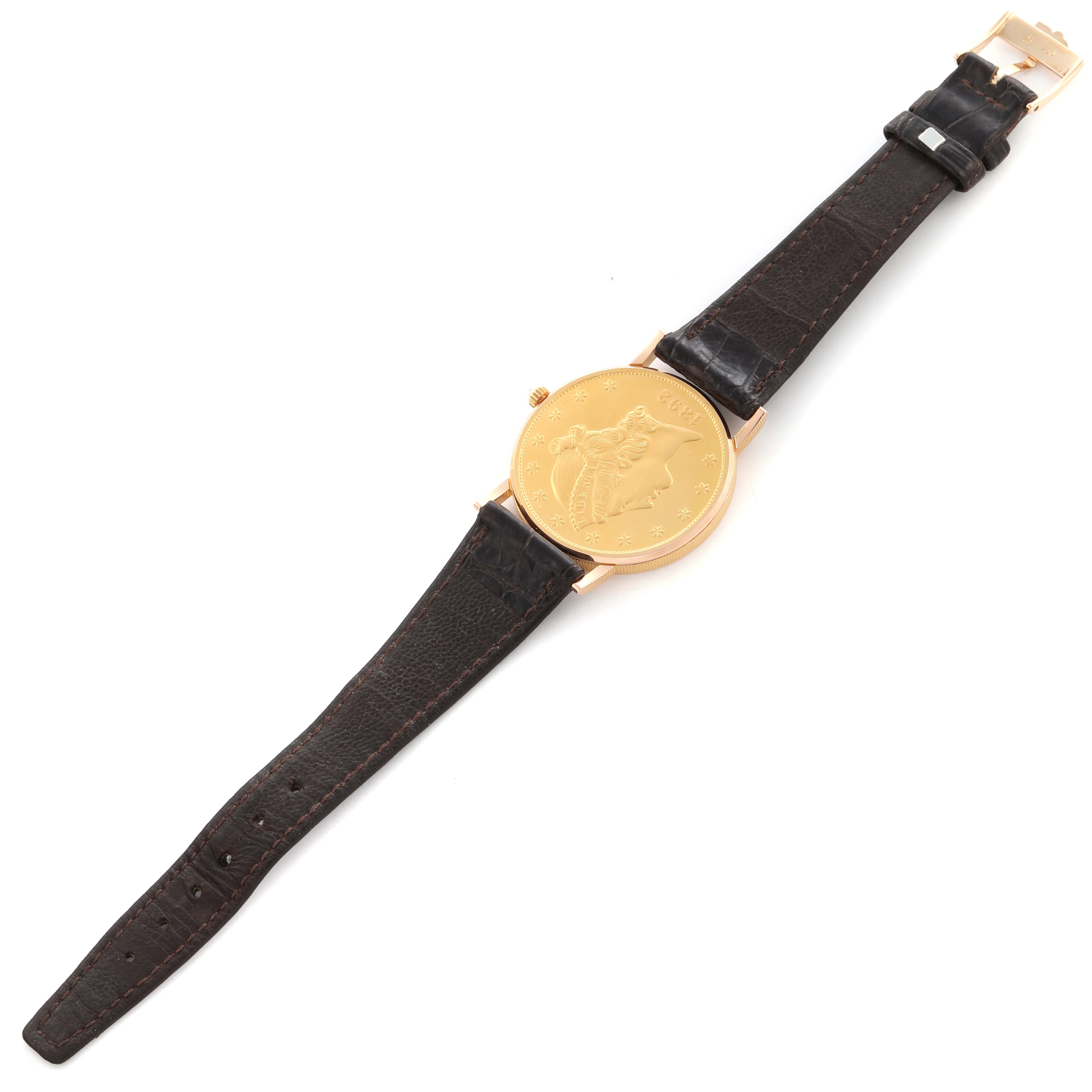 The Corum Coin Watch 4414556 Men's Yellow Gold Champagne Dial 4414556 Men's Yellow Gold Champagne Dial is displayed flat from a top-down angle, showing the full watch face and leather strap.