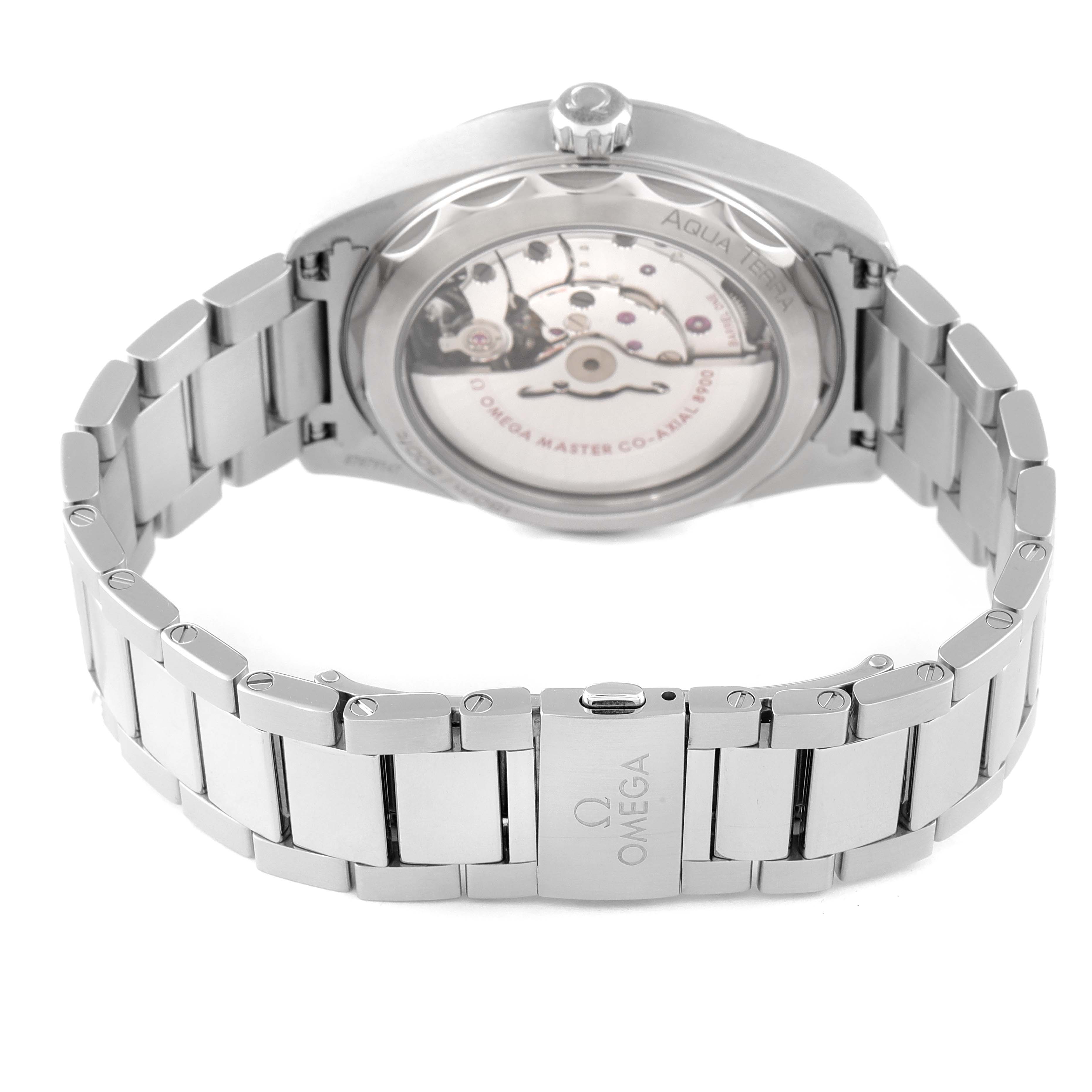 The image shows the case back and bracelet of an Omega Aqua Terra 220.10.41.21.03.004 Men
s Stainless Steel Blue Dial 220.10.41.21.03.004 Men
s Stainless Steel Blue Dial watch, highlighting its mechanical movement.