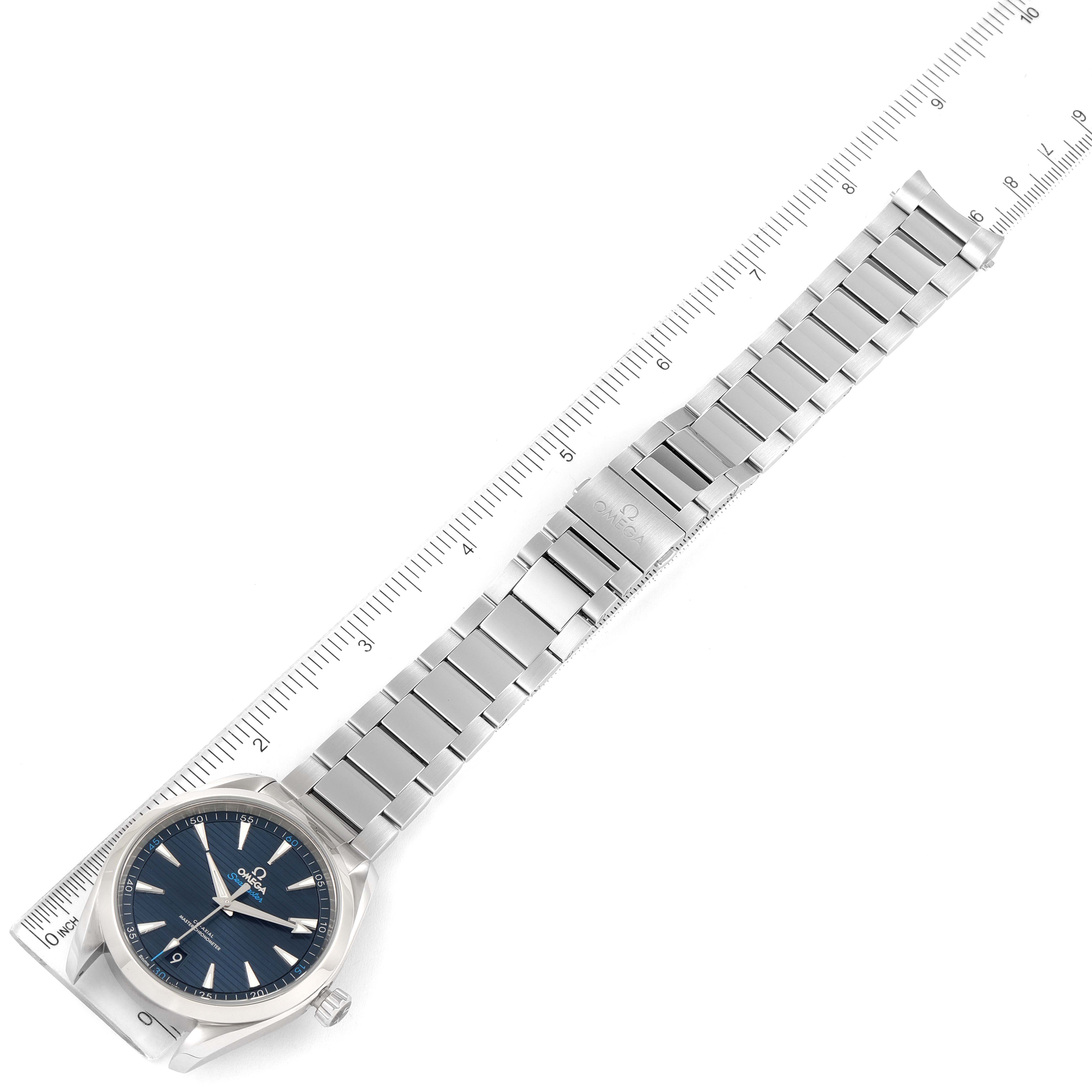 The image shows an Omega Aqua Terra 220.10.41.21.03.004 Men
s Stainless Steel Blue Dial 220.10.41.21.03.004 Men
s Stainless Steel Blue Dial watch laying flat, displaying the full length of its face, bracelet, and clasp, alongside a measuring ruler.