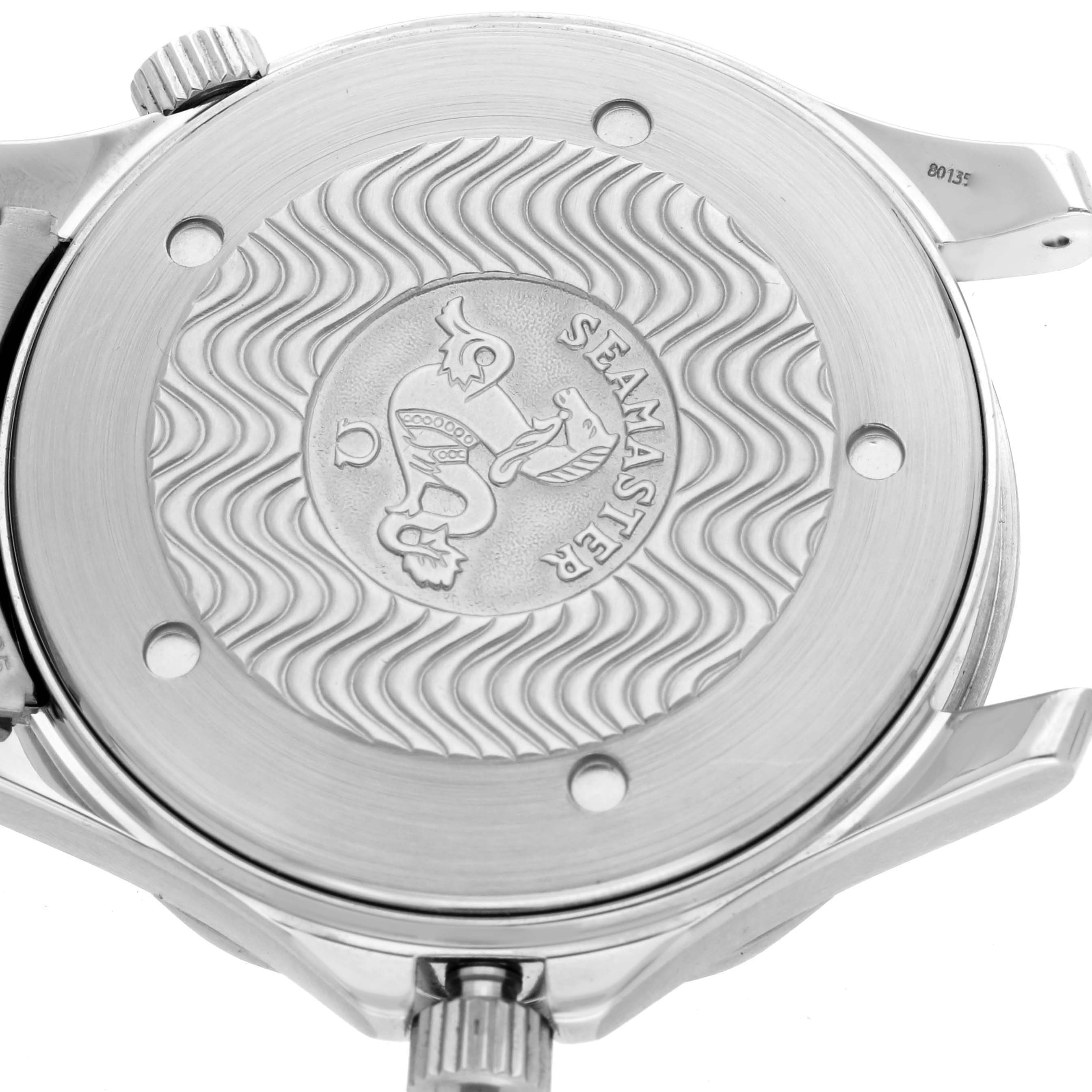 The image shows the back casing of an Omega Seamaster 2531.80.00 Men
s Stainless Steel Blue Dial 2531.80.00 Men
s Stainless Steel Blue Dial watch, highlighting the engraved logo and wave pattern from a top angle.