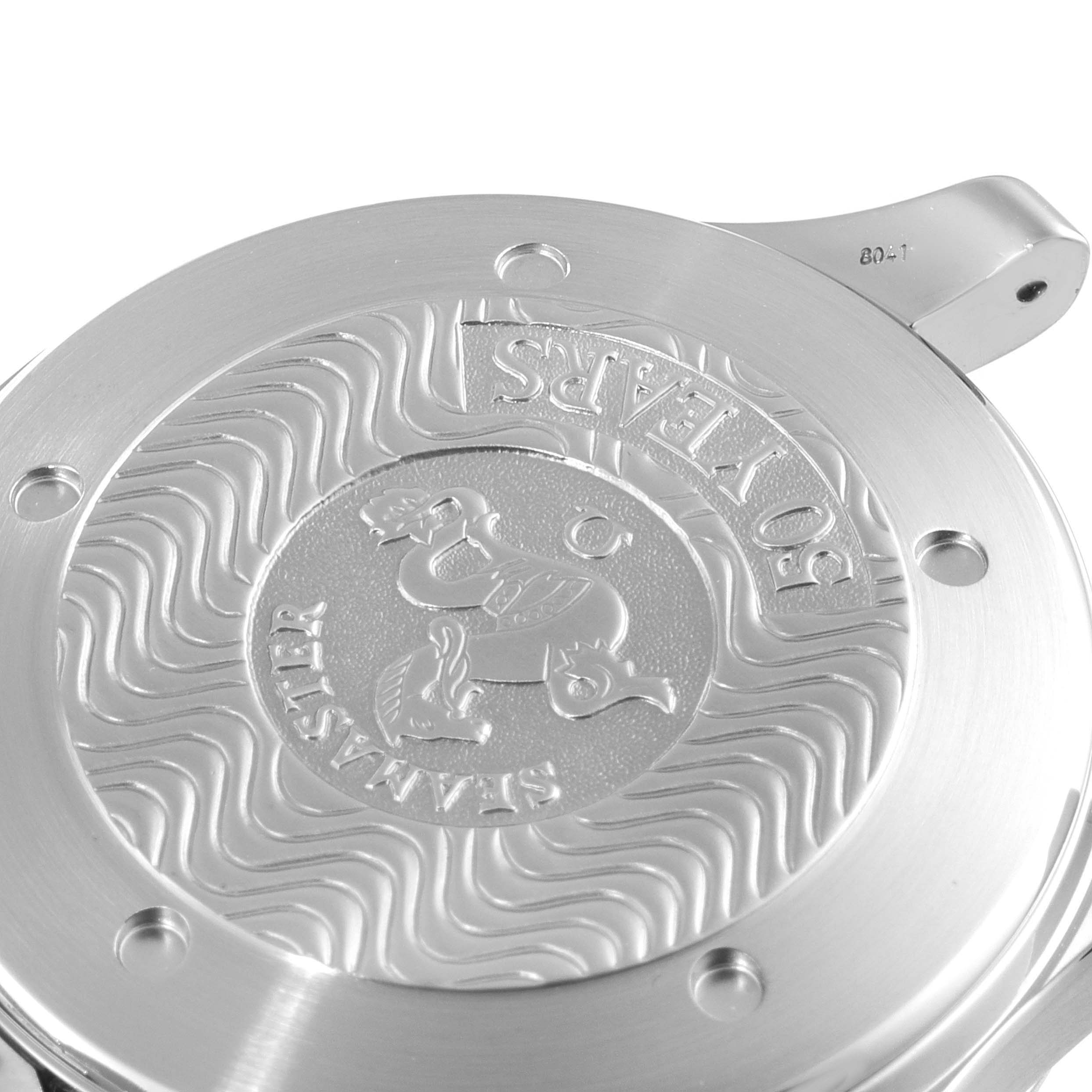 The image shows the case back of an Omega Seamaster 2234.50.00 Men's Stainless Steel Black Dial 2234.50.00 Men's Stainless Steel Black Dial watch with the engraved logo and wave pattern design.
