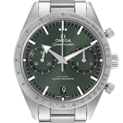 The Omega Speedmaster watch is shown from the front, displaying its green dial, subdials, and tachymeter bezel.