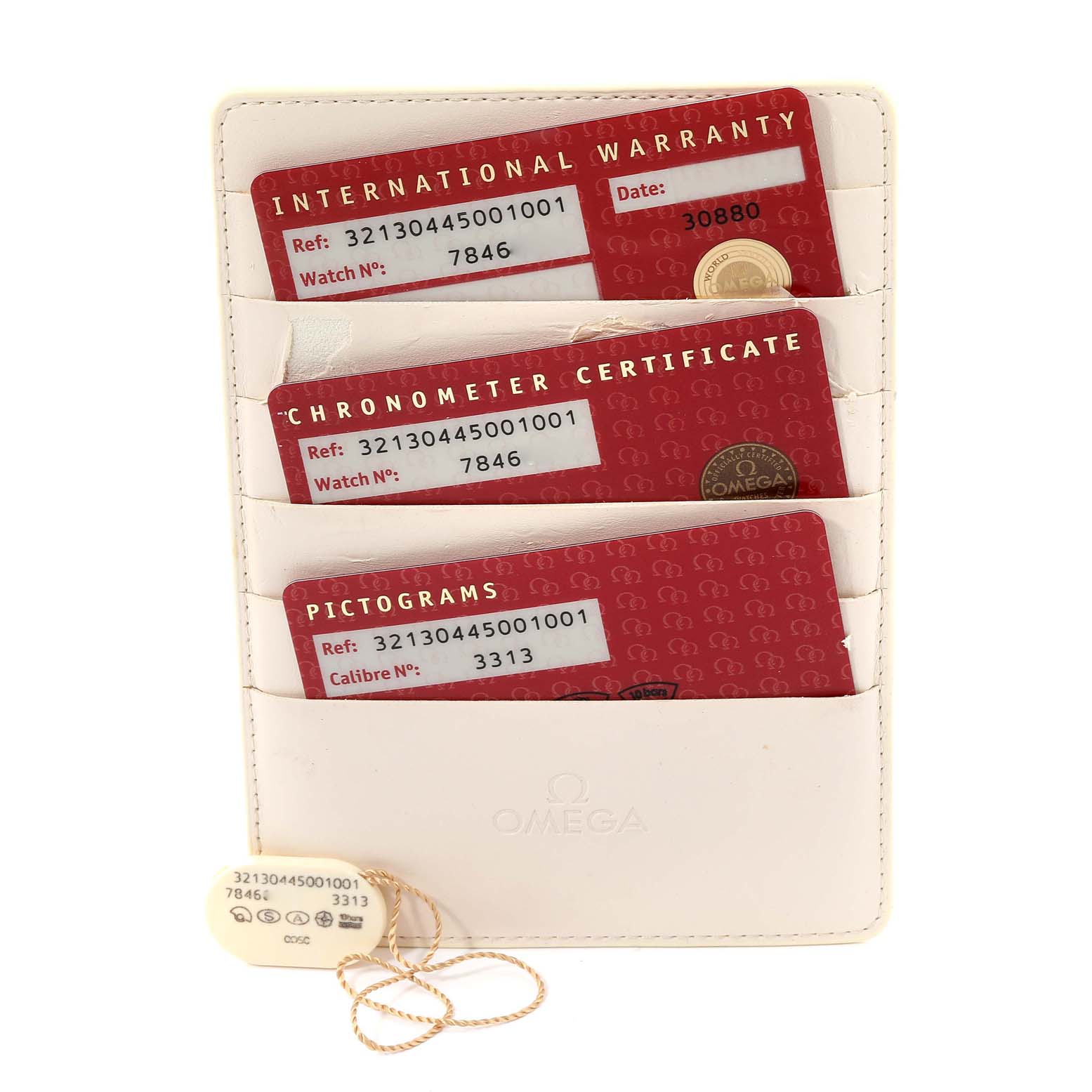 The image shows warranty cards and certifications for an Omega Speedmaster 321.30.44.50.01.001 Men's Stainless Steel Black Dial 321.30.44.50.01.001 Men's Stainless Steel Black Dial, placed in a white holder.