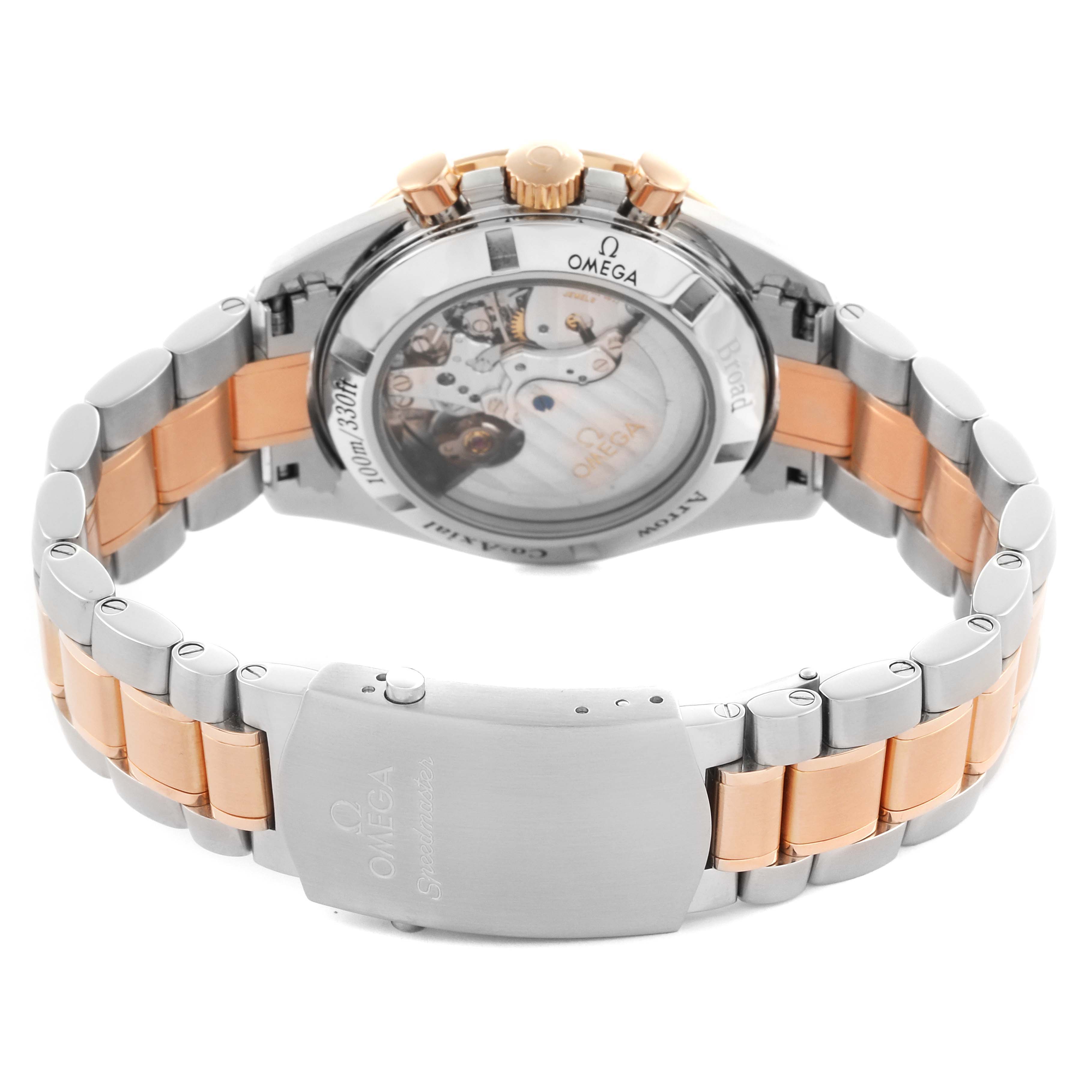 The Omega Speedmaster 321.90.42.50.13.001 Men's Steel and Gold (two tone) Brown Dial 321.90.42.50.13.001 Men's Steel and Gold (two tone) Brown Dial watch is shown from the back, highlighting the transparent case back, bracelet, and clasp.