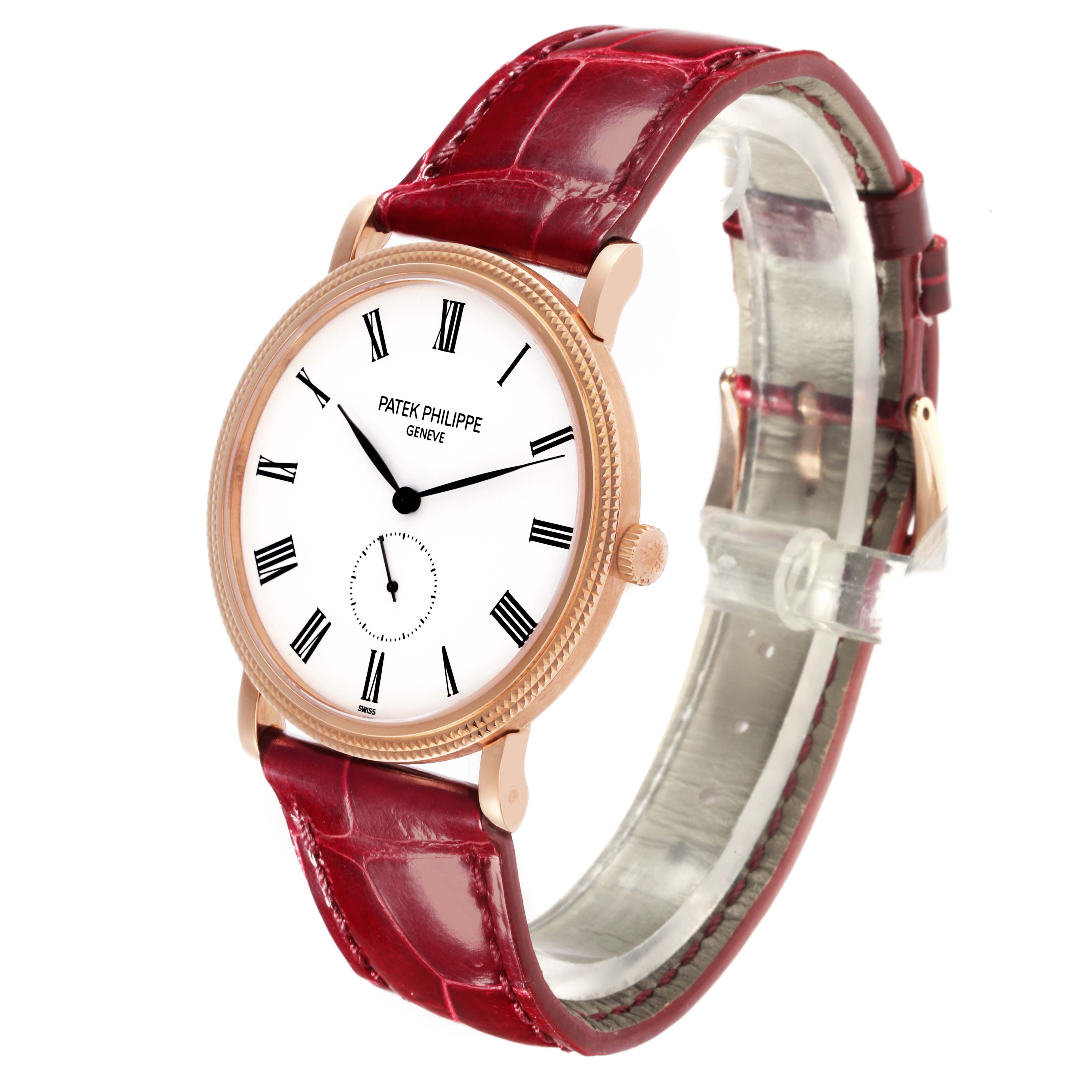 The Patek Philippe Calatrava 5119R-001 Men's Rose Gold White Dial 5119R-001 Men's Rose Gold White Dial watch is shown at a slight angle displaying the face, bezel, side crown, and red leather strap.