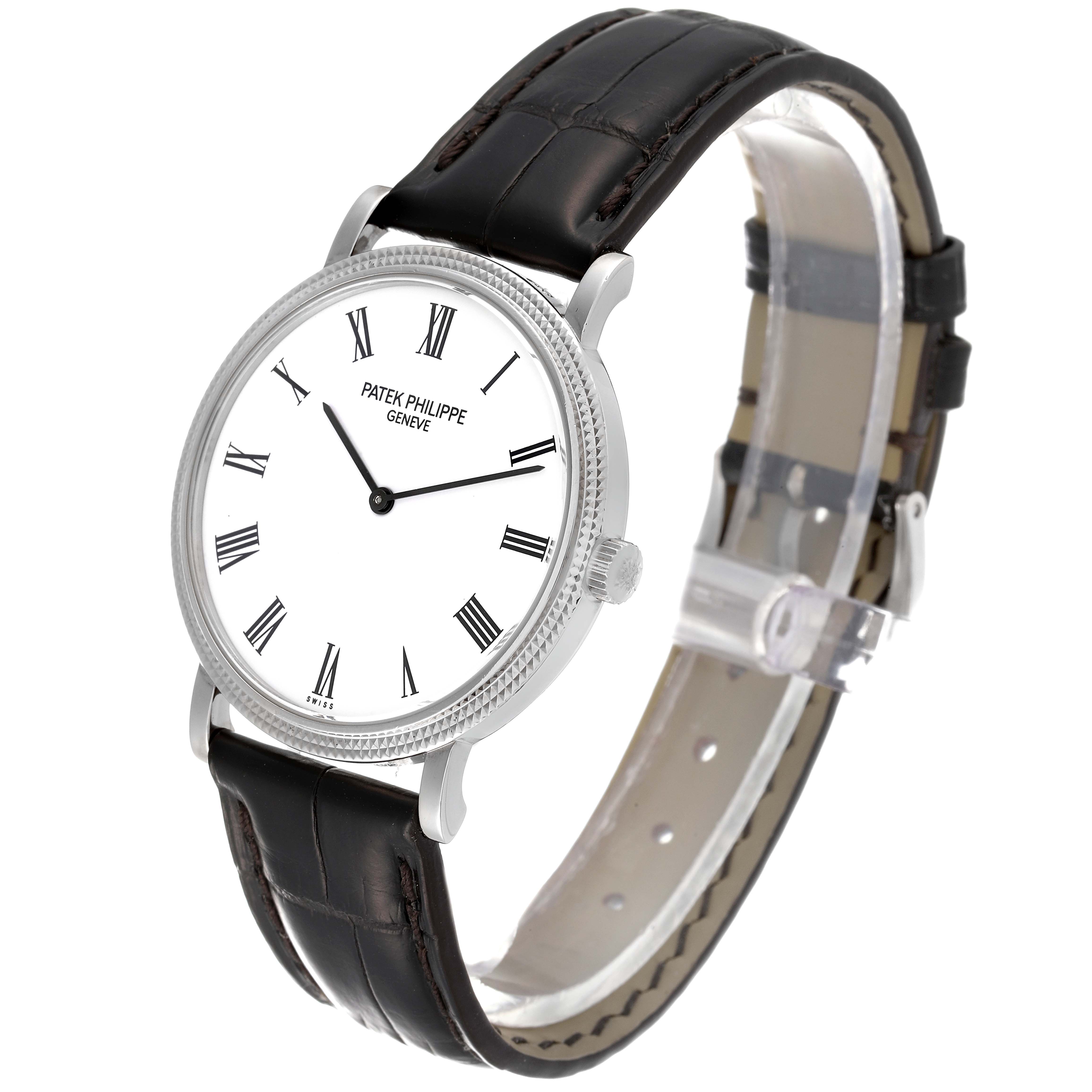 This image shows a Patek Philippe Calatrava 5120G Men's White Gold White Dial 5120G Men's White Gold White Dial watch at a three-quarter angle, showcasing its face, bezel, and leather strap.