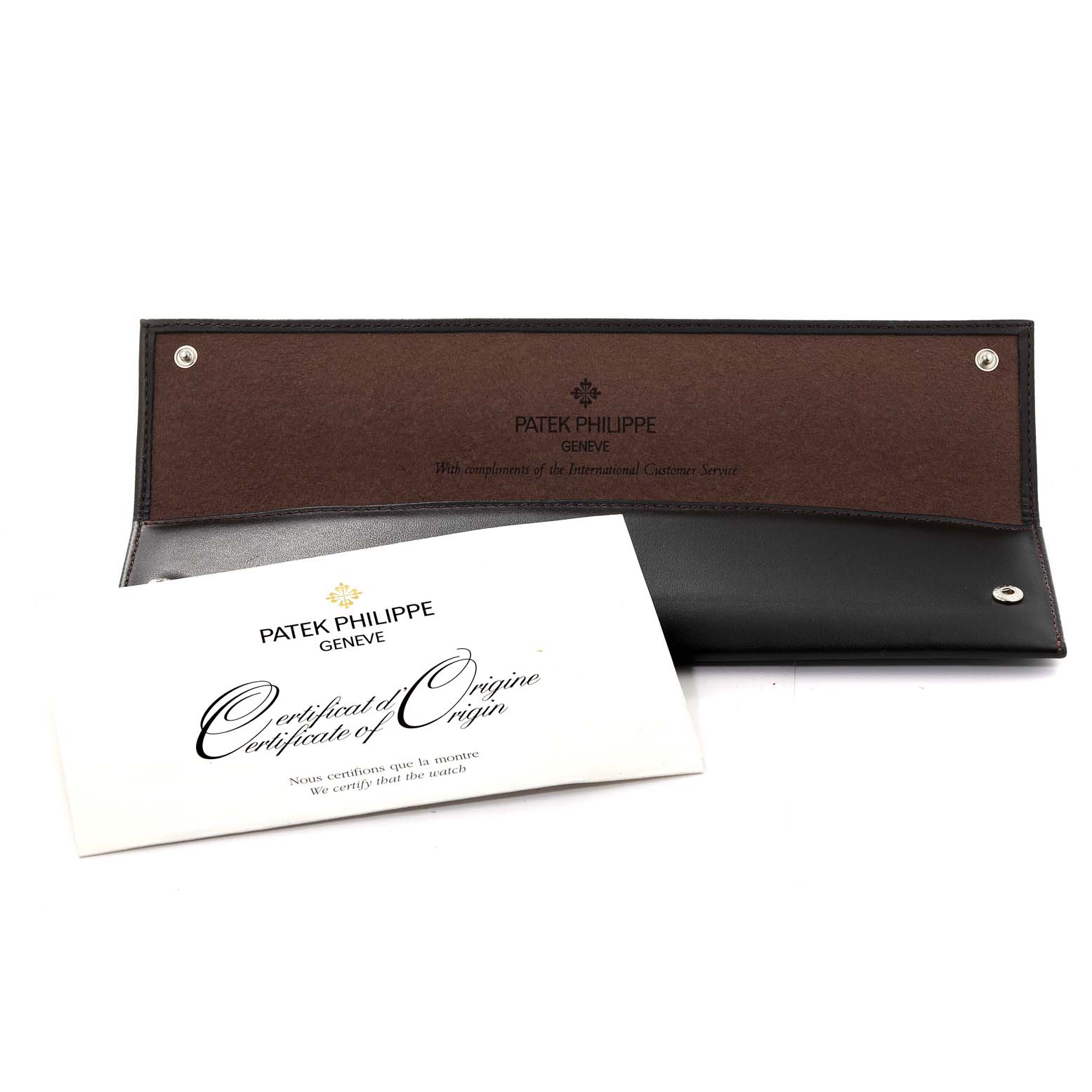 The image shows a Patek Philippe Calatrava 5120G Men's White Gold White Dial 5120G Men's White Gold White Dial watch leather case and a Certificate of Origin document at an angled view.