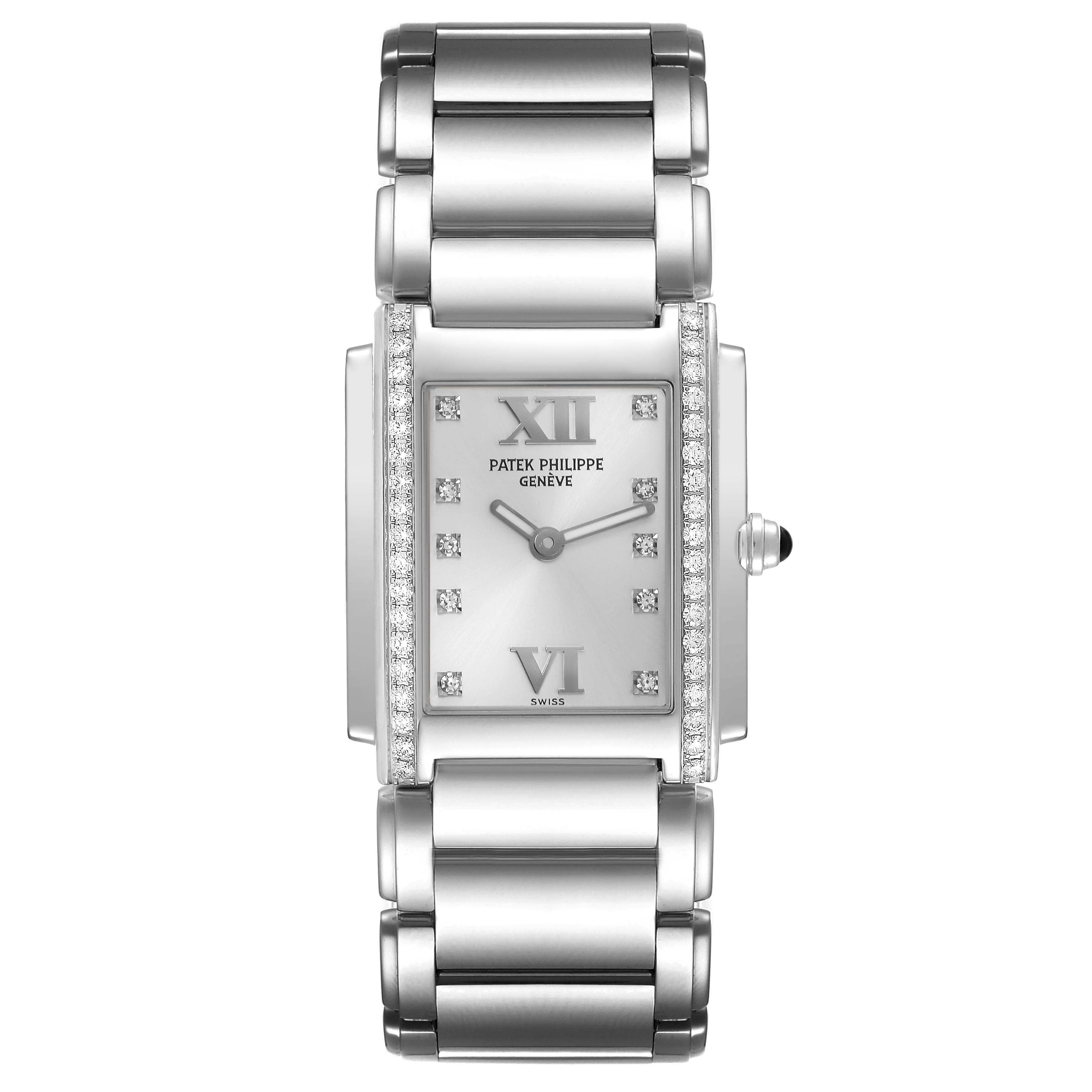 The image shows a front view of the Patek Philippe Twenty-4 4910/10A-011 Women's Stainless Steel Silver Dial 4910/10A-011 Women's Stainless Steel Silver Dial, displaying its rectangular face and metal bracelet.