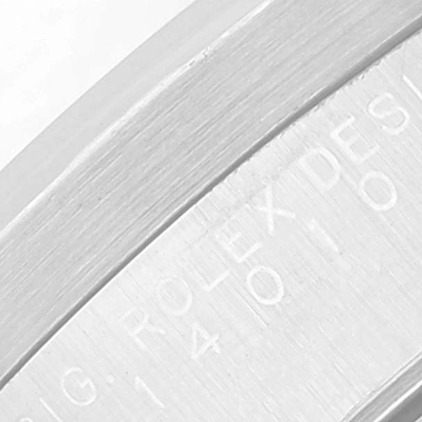 This close-up image shows part of the case and engraved text on the bezel of the Rolex Air-King 14010 Men's Stainless Steel Blue Dial 14010 Men's Stainless Steel Blue Dial watch.